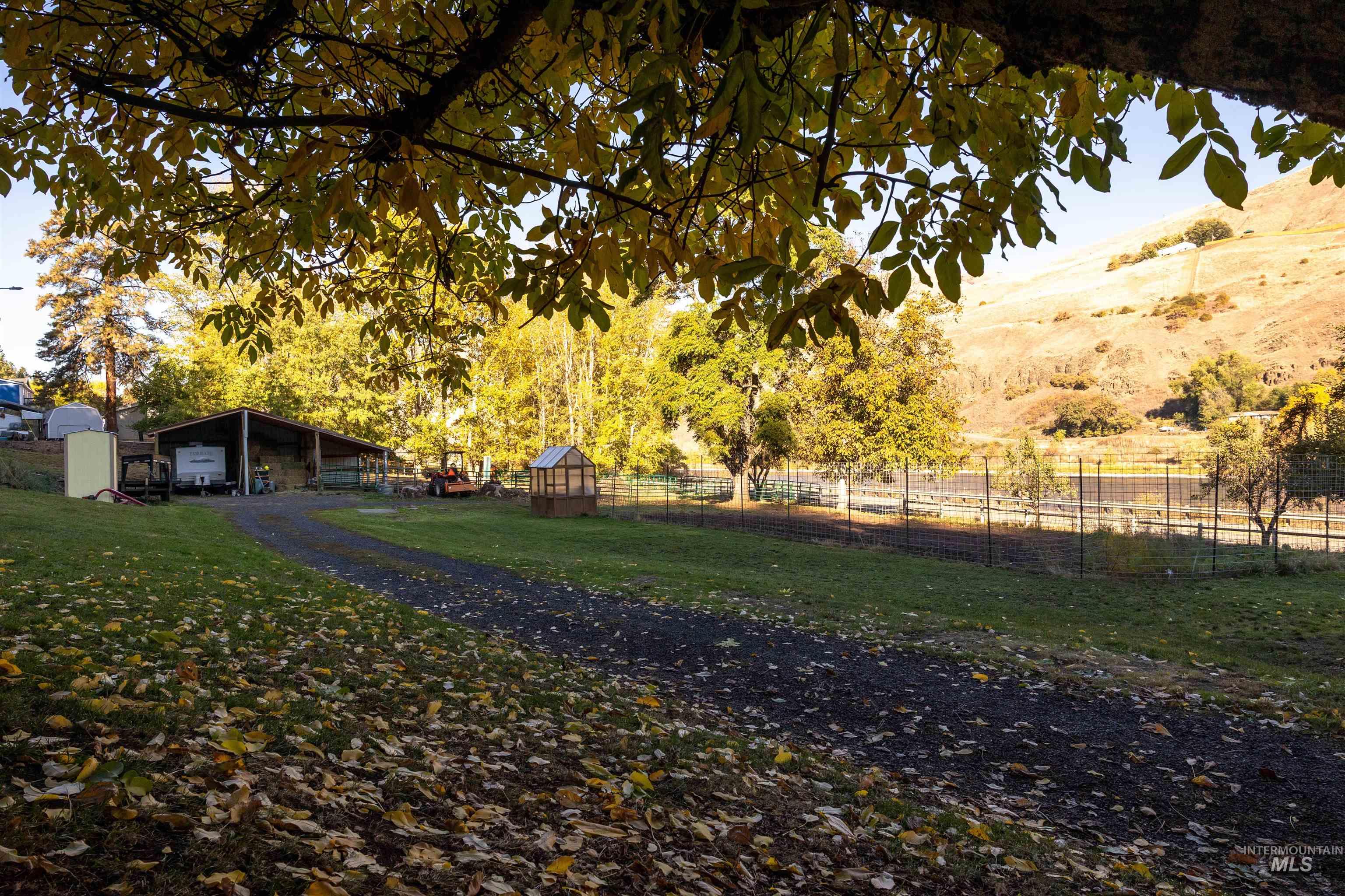 View of home's community featuring an outbuilding and a carport