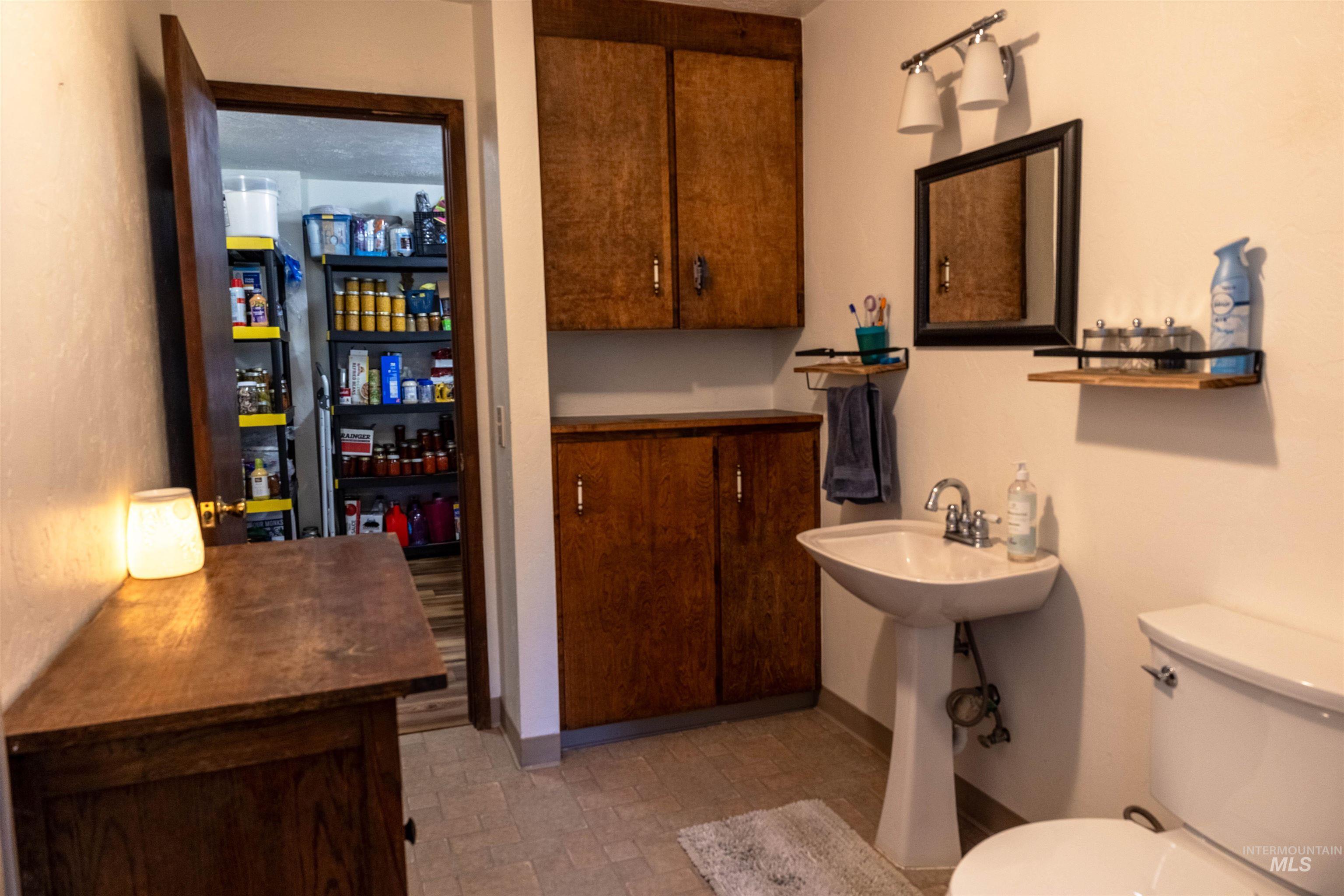 Bathroom featuring toilet and baseboards
