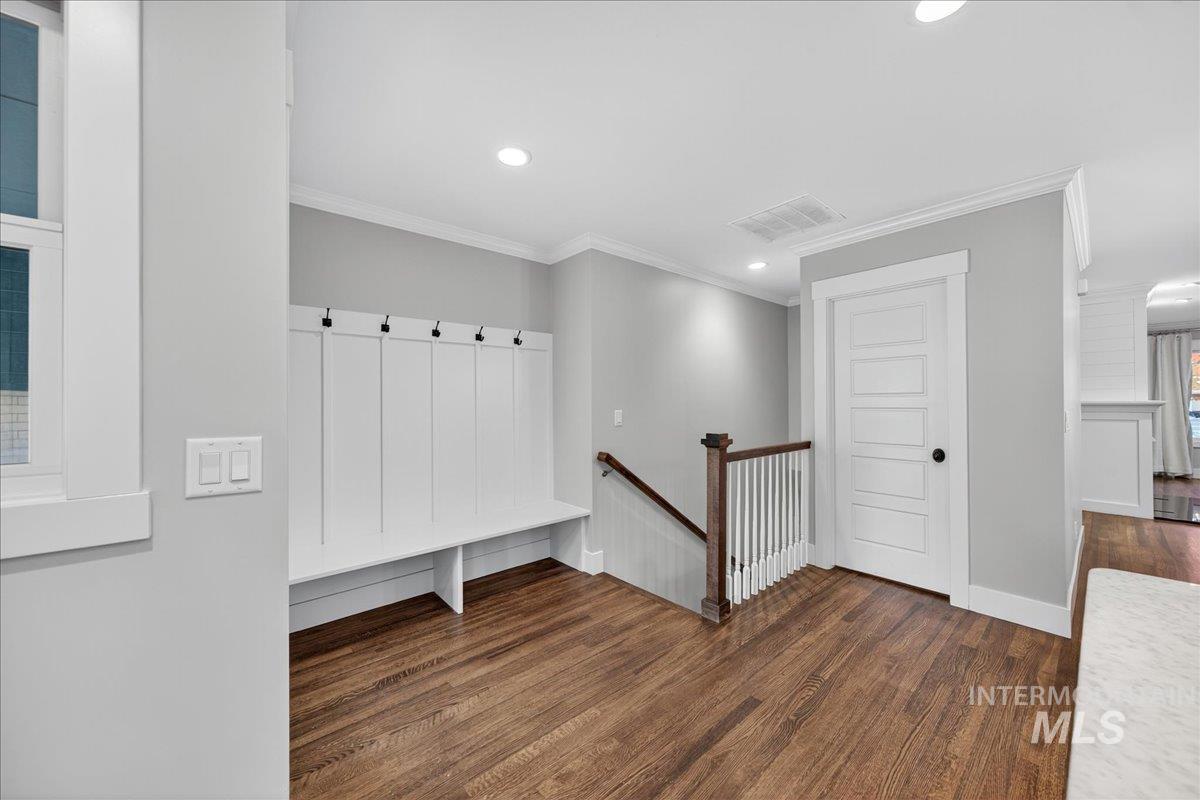 Mudroom featuring crown molding, dark wood finished floors, and recessed lighting