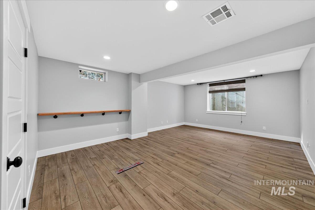 Spare room with recessed lighting and light wood-type flooring