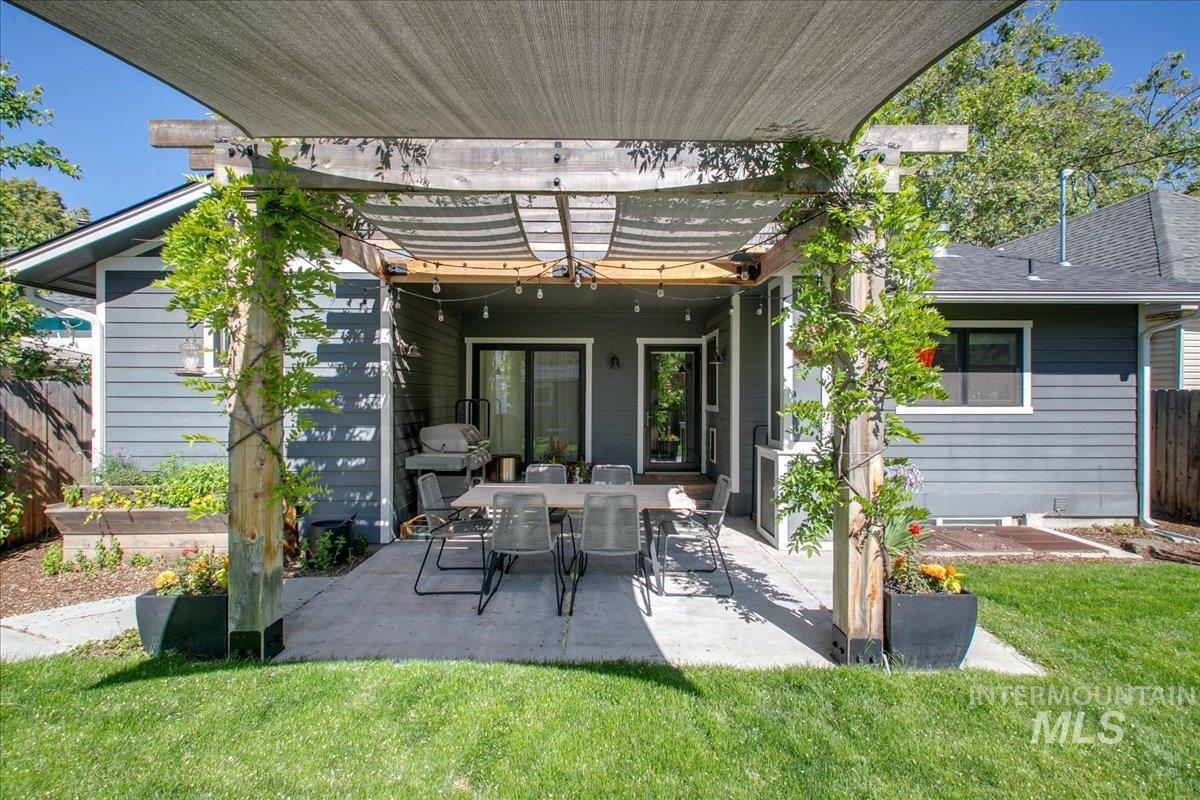 Back of house with a patio and a pergola