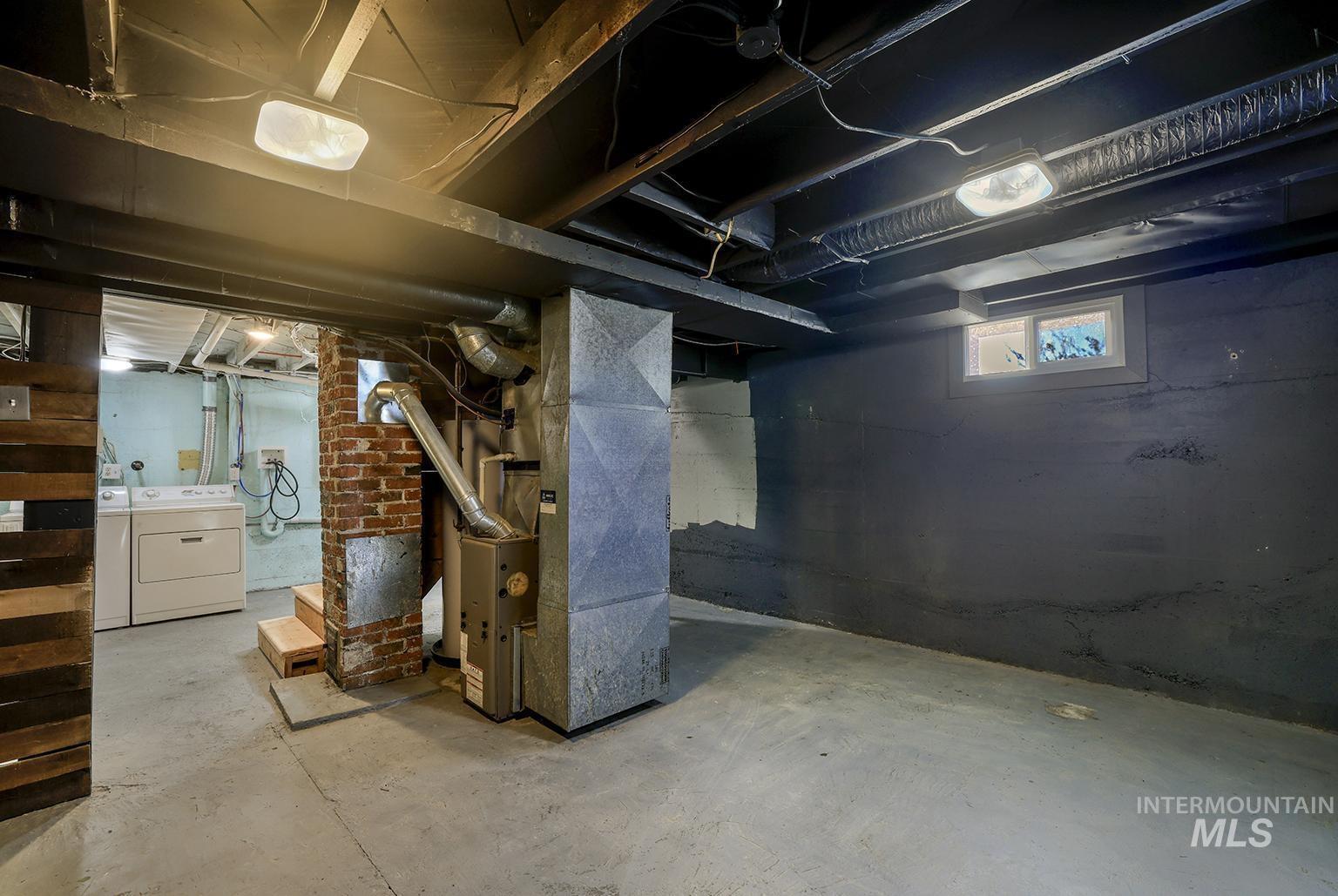 Basement with heating unit and independent washer and dryer