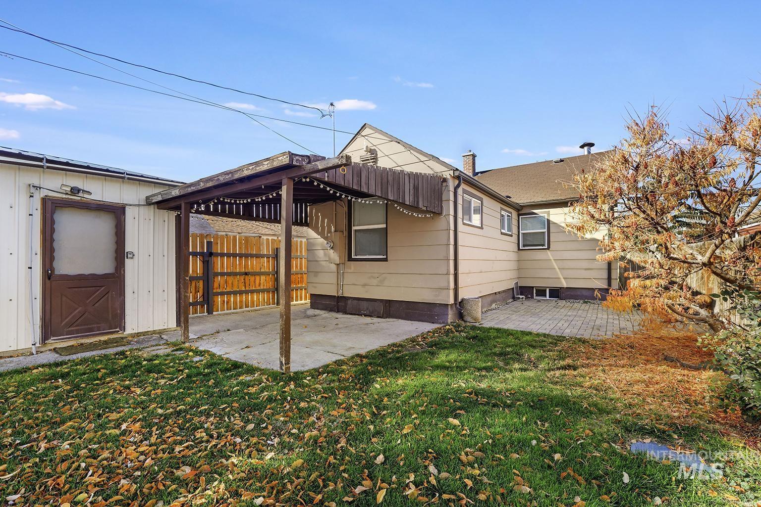 Rear view of house featuring a patio area
