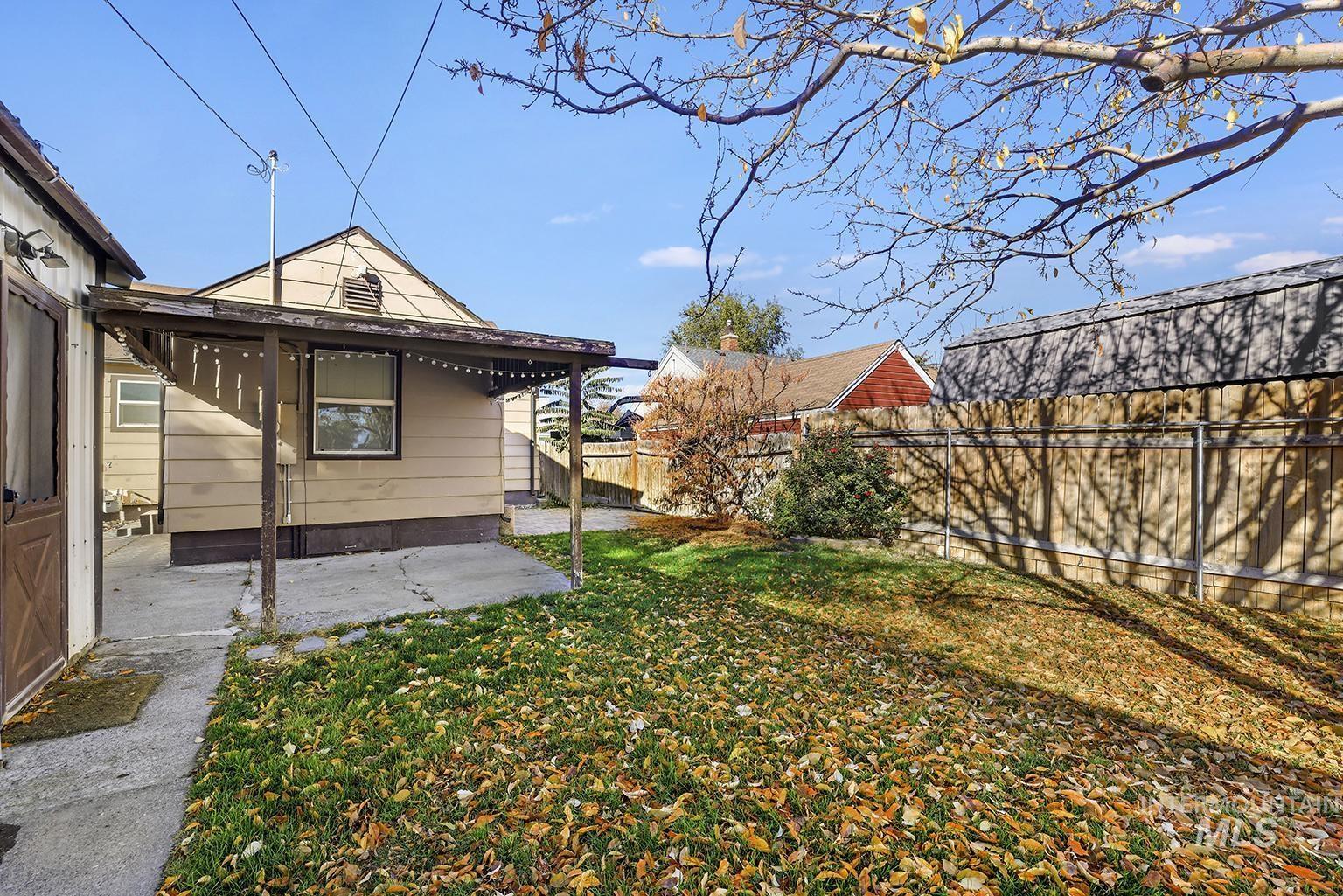 Fenced backyard featuring a patio