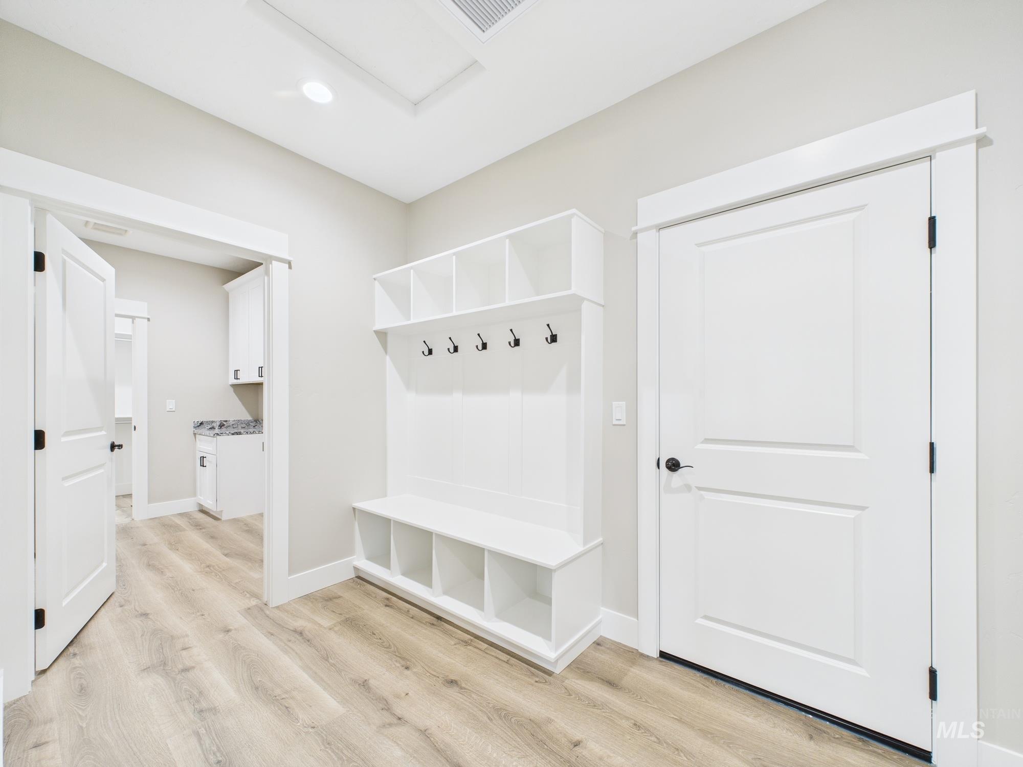 Mudroom featuring light wood-type flooring