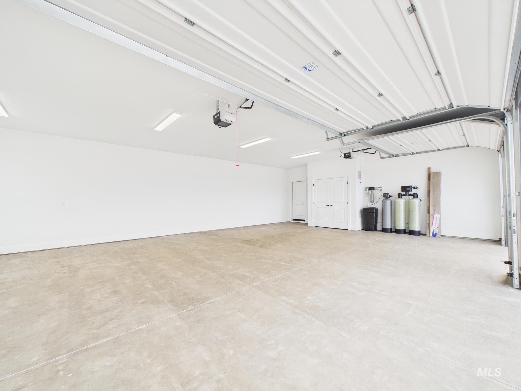 Garage featuring a garage door opener