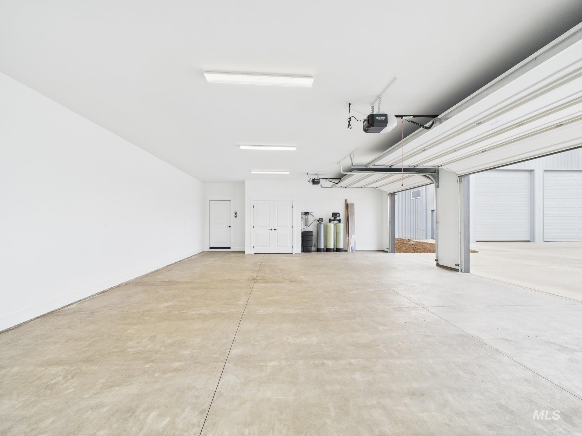 Garage featuring a garage door opener