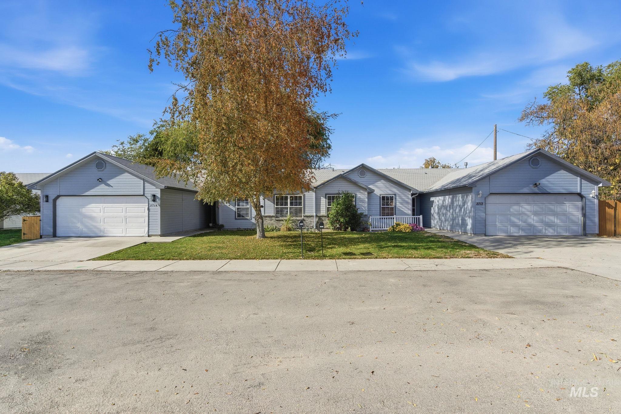 Single story home featuring a front yard and driveway
