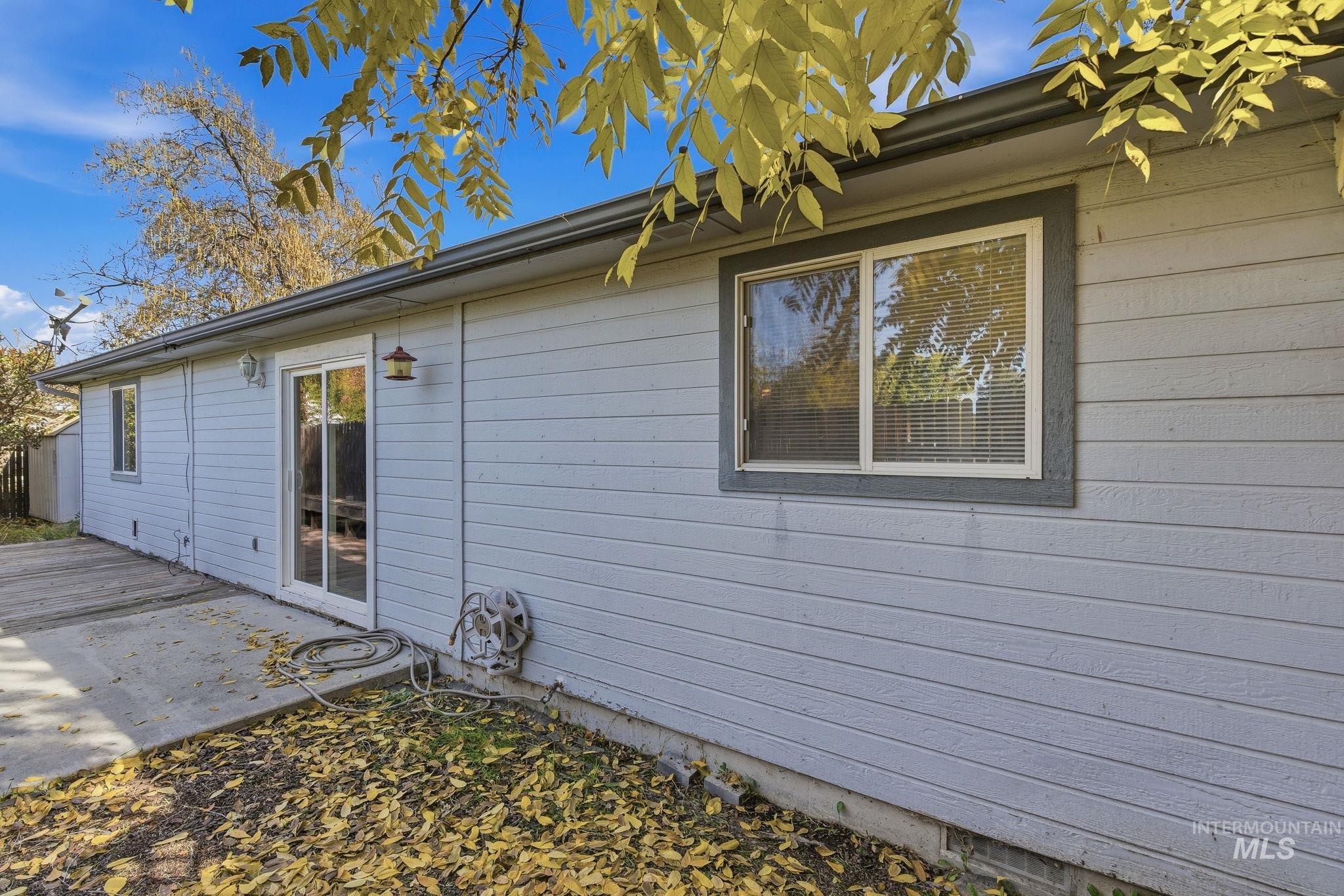 View of side of property featuring a patio area