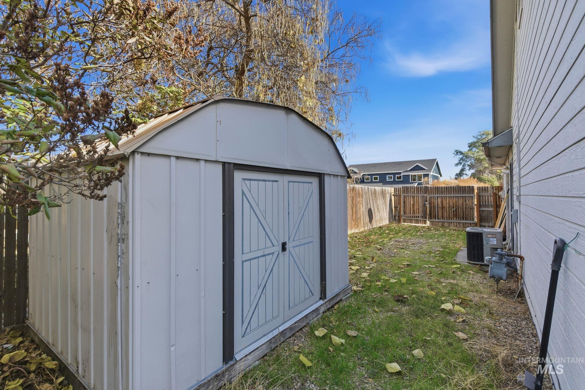View of shed featuring a fenced backyard