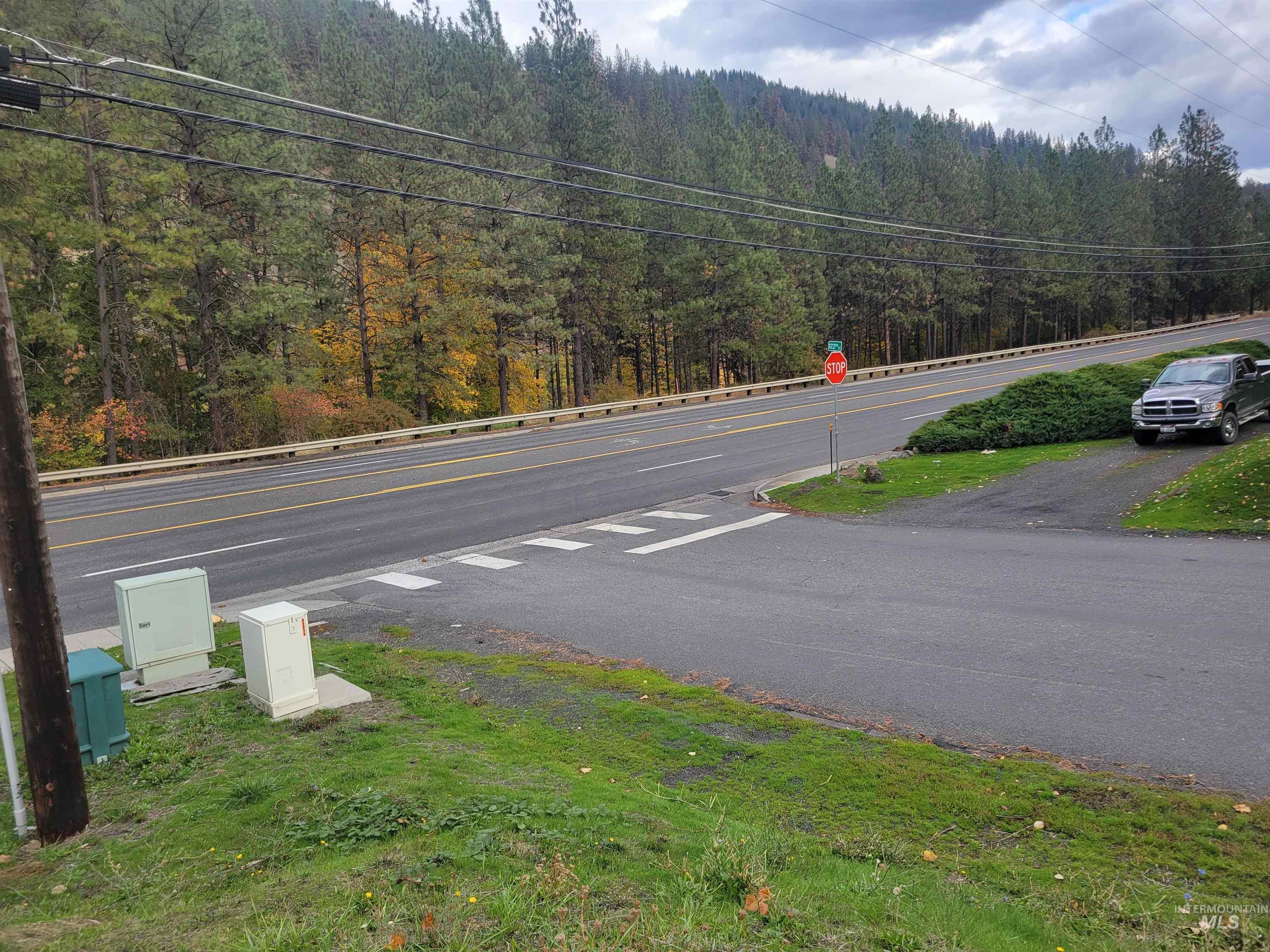 View of asphalt road with a forest view