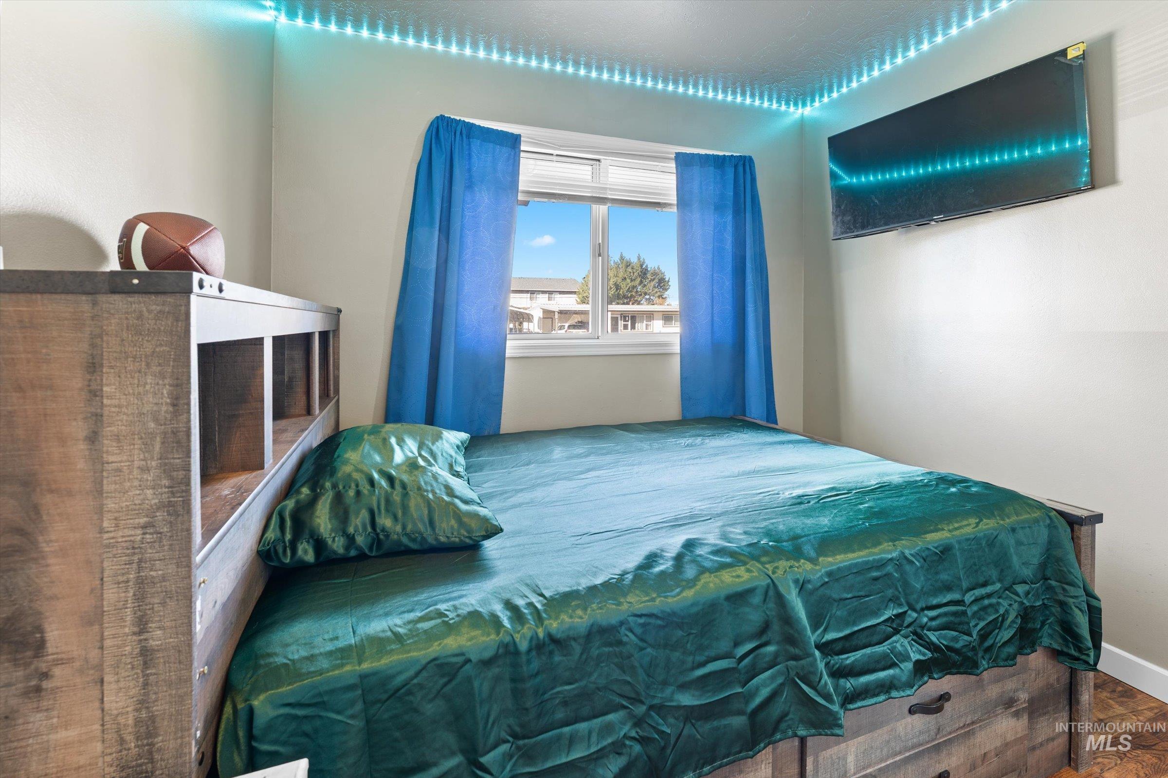Bedroom with wood finished floors