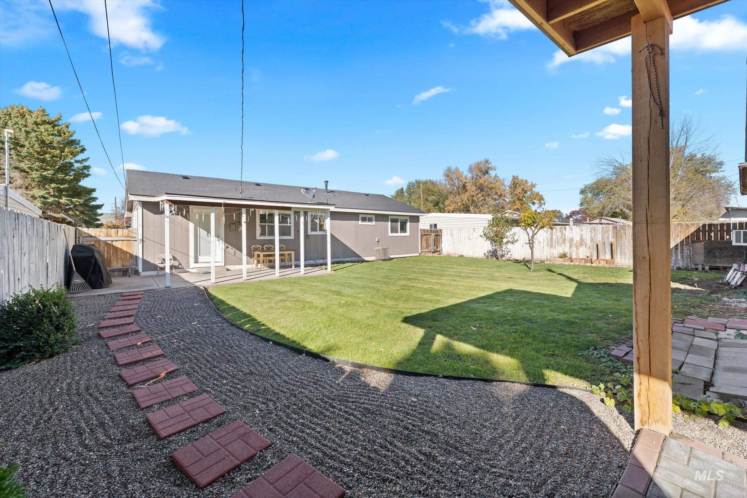 Back of house with a patio and a fenced backyard