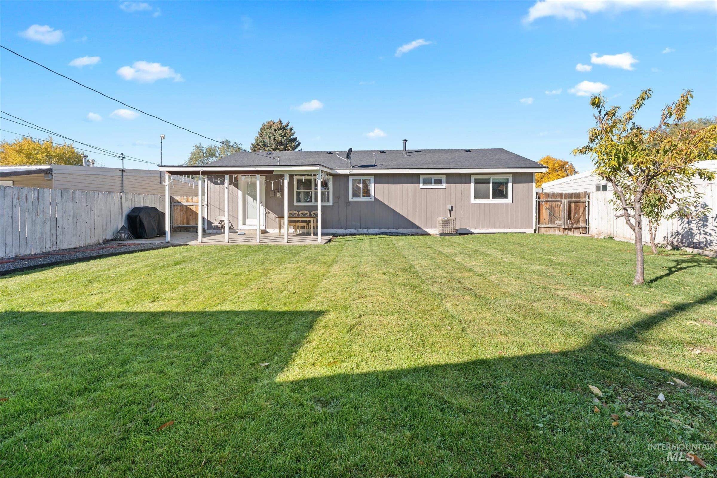 Back of house featuring a patio and a fenced backyard