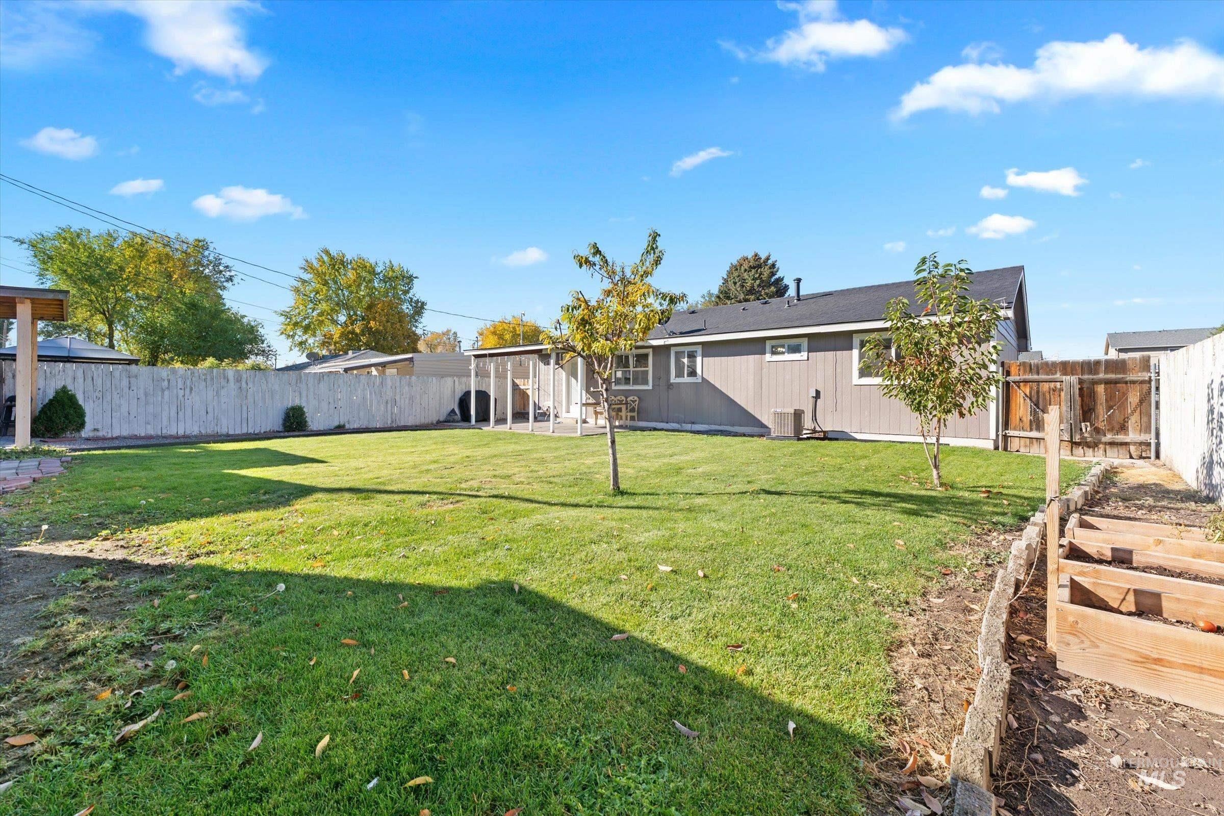 Fenced backyard featuring a patio area