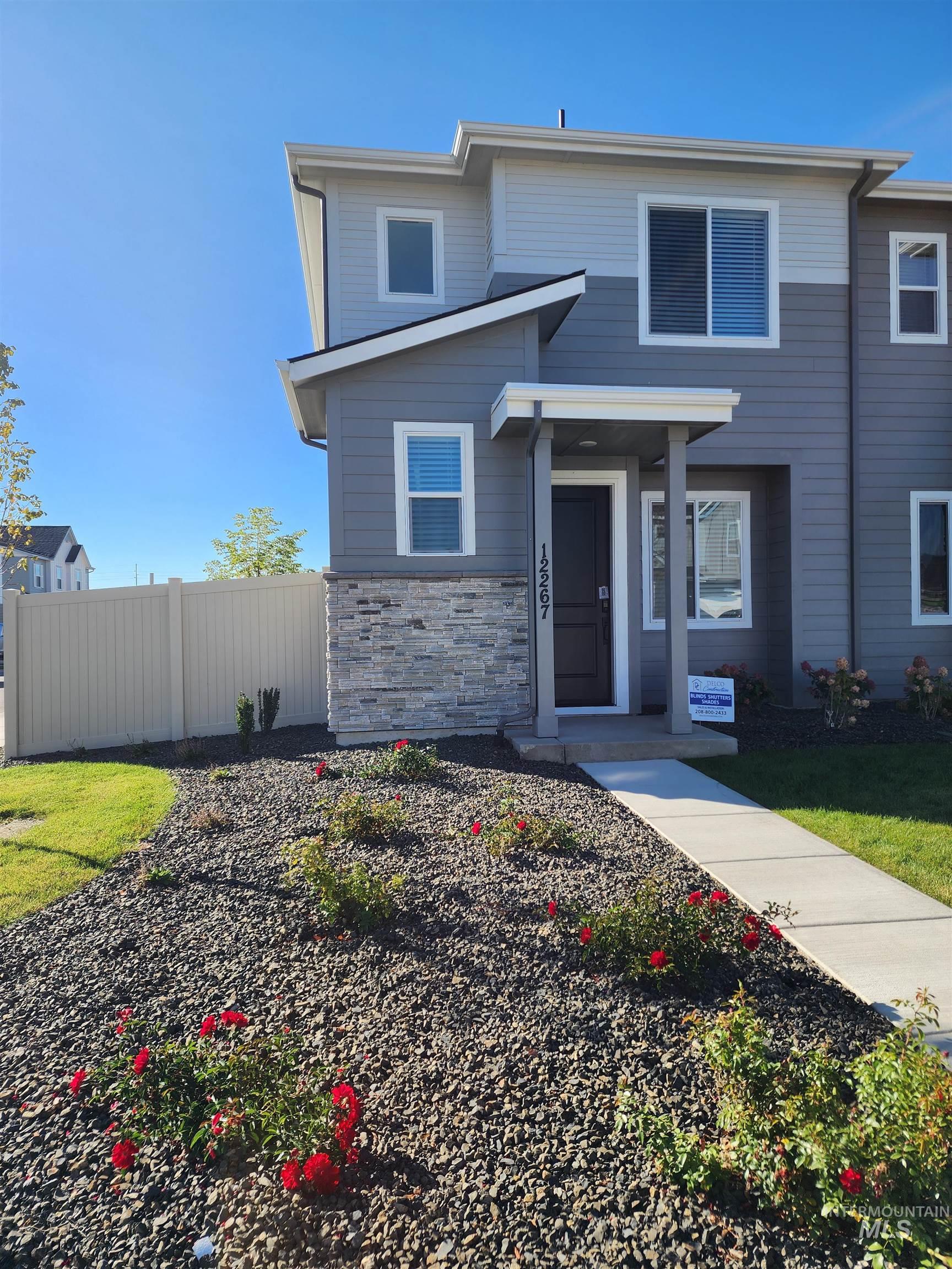 View of front of house featuring stone siding