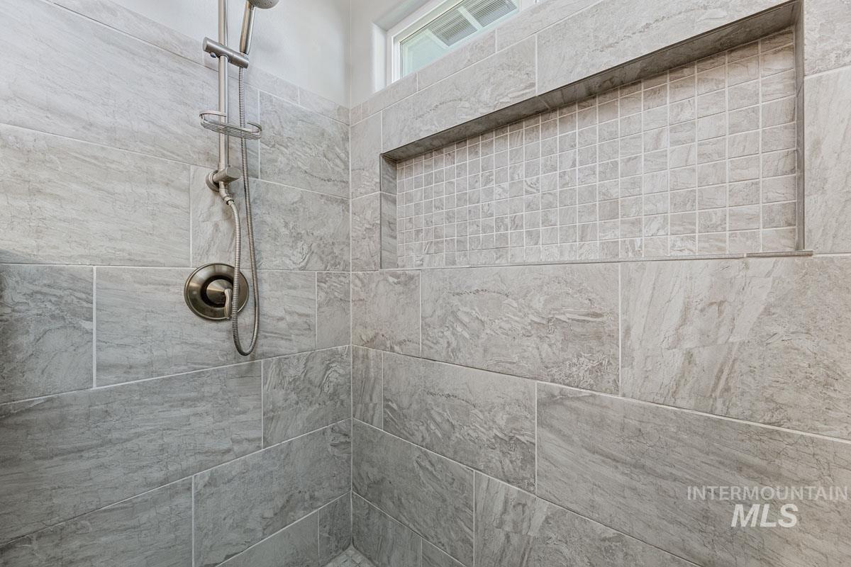 Bathroom view of tiled shower