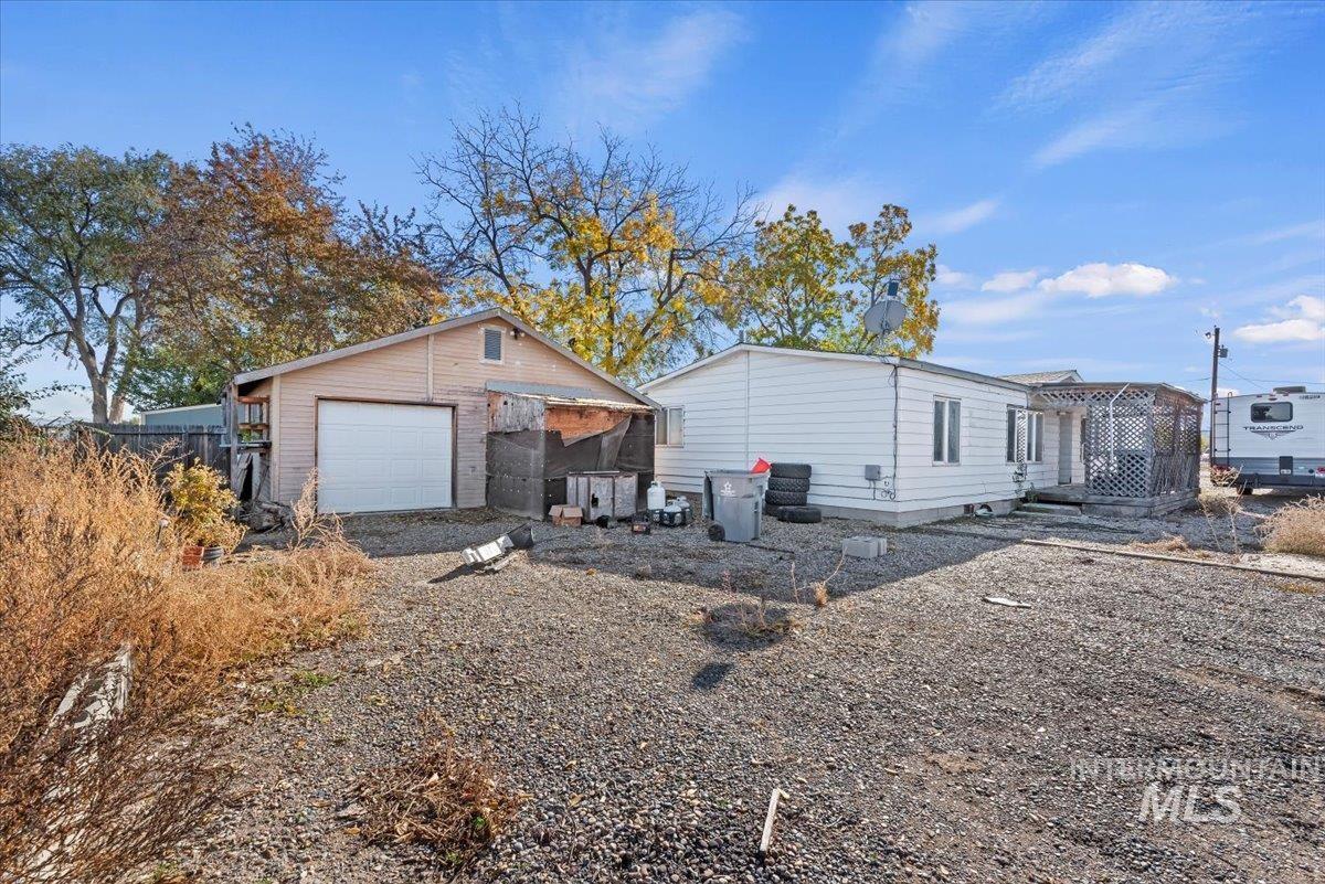 View of property exterior with an outbuilding and driveway