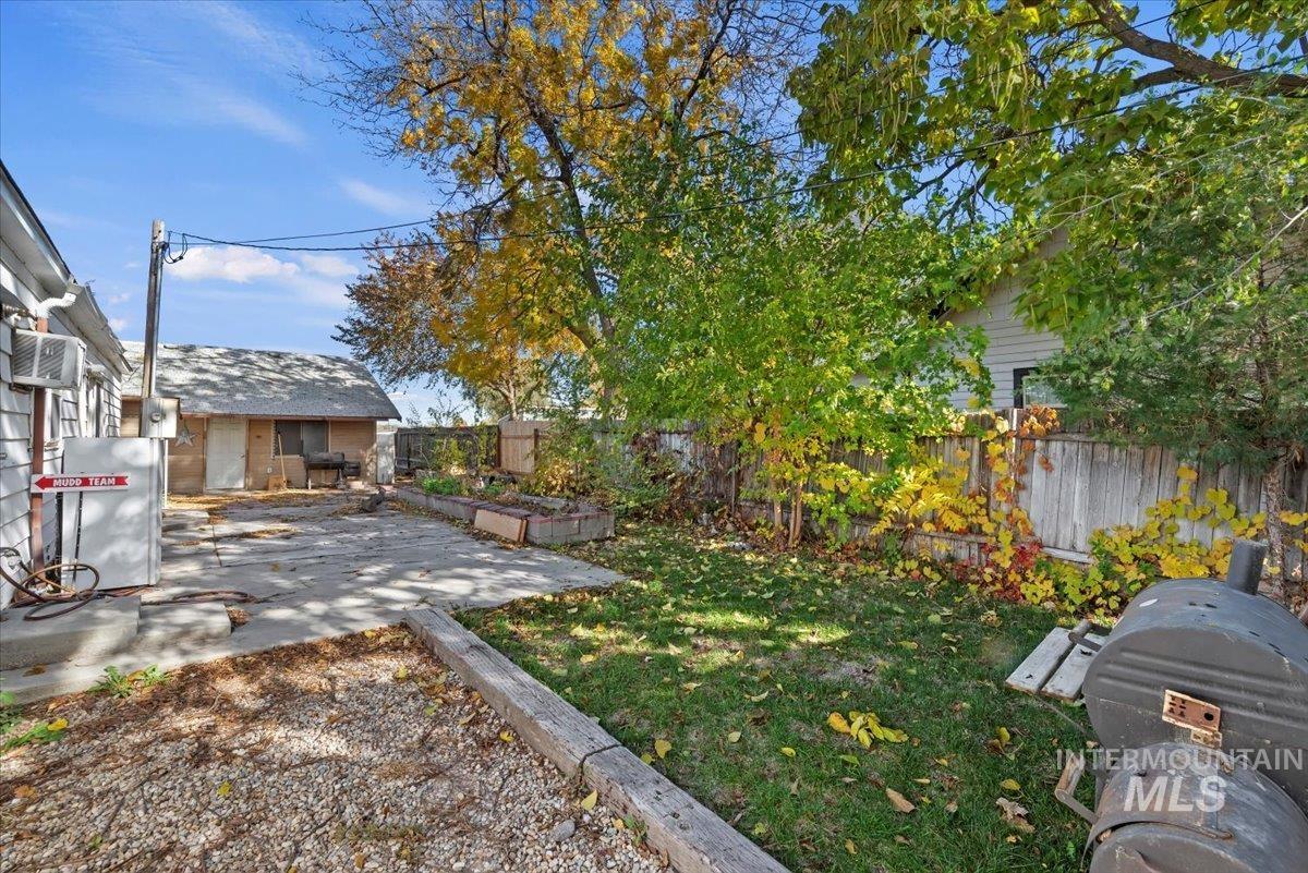 Fenced backyard featuring a patio