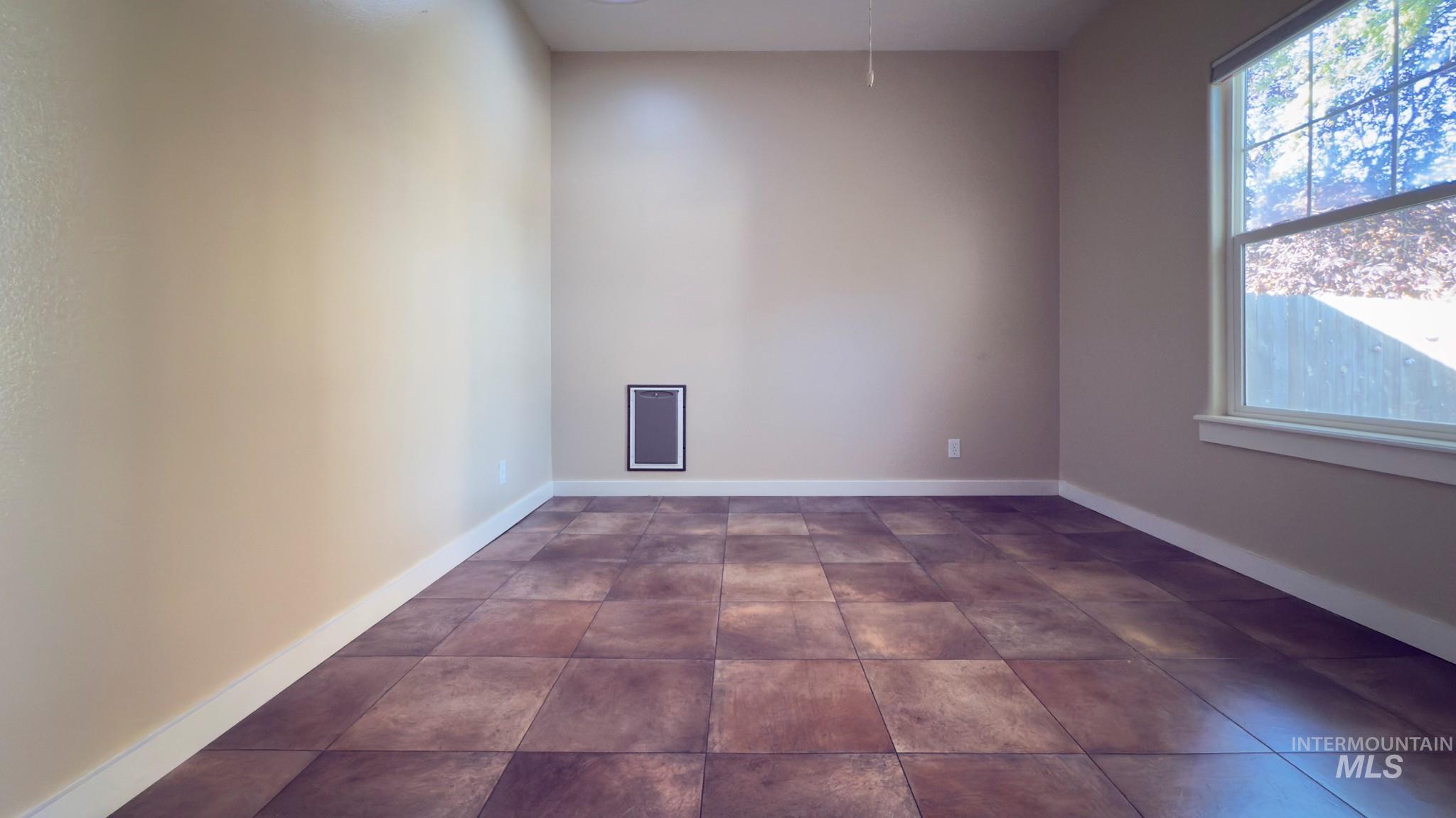 Spare room featuring plenty of natural light