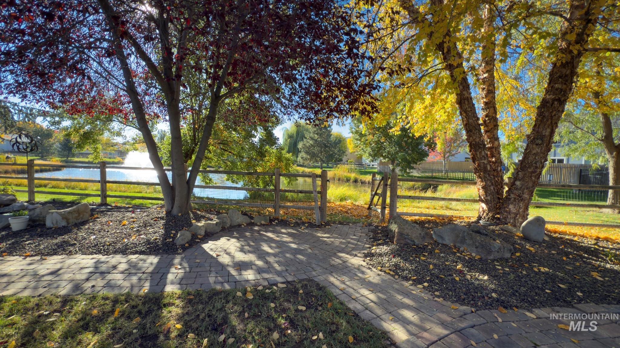 View of patio / terrace with a water view and a gate