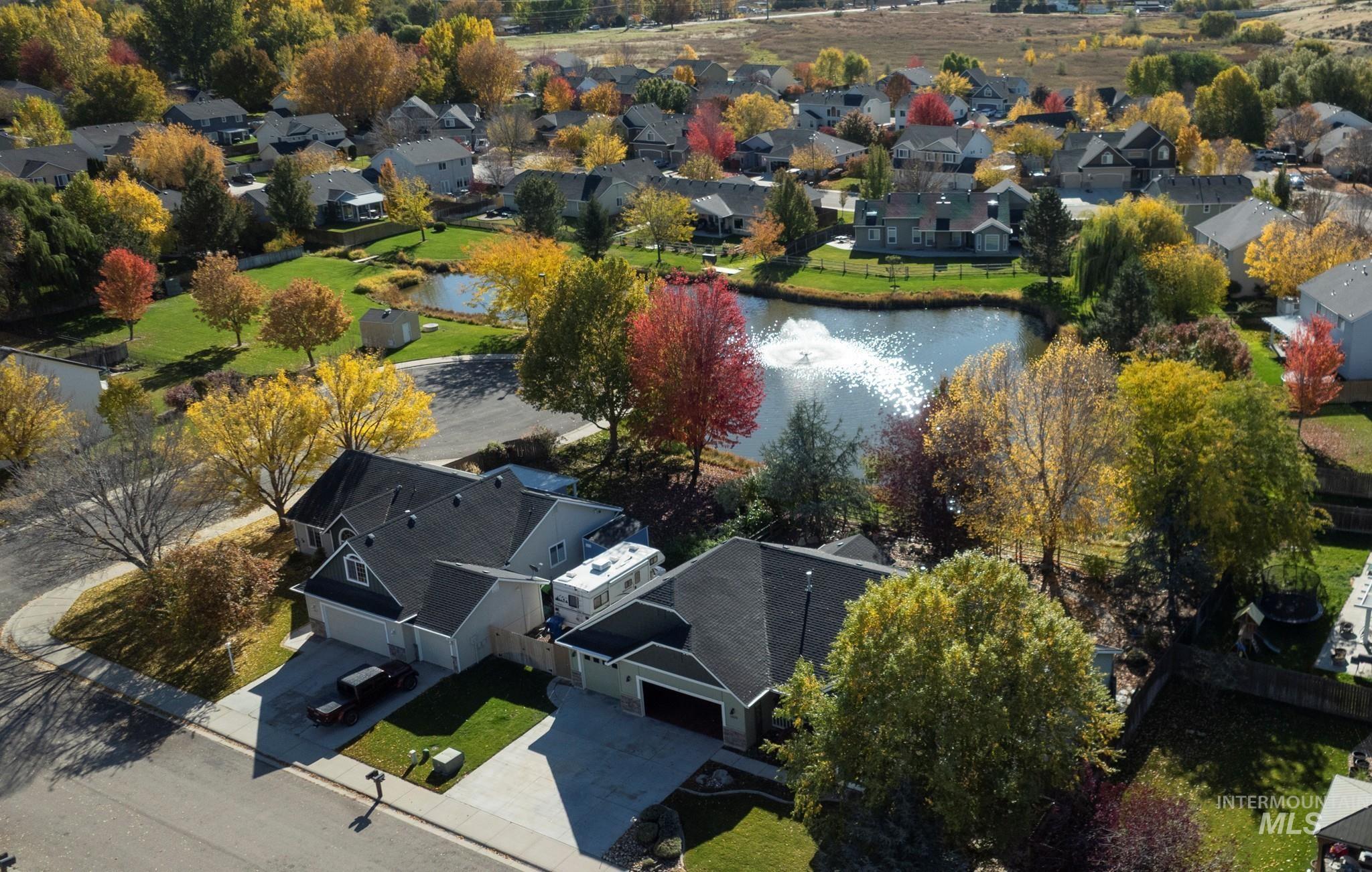 Aerial perspective of suburban area with a nearby body of water