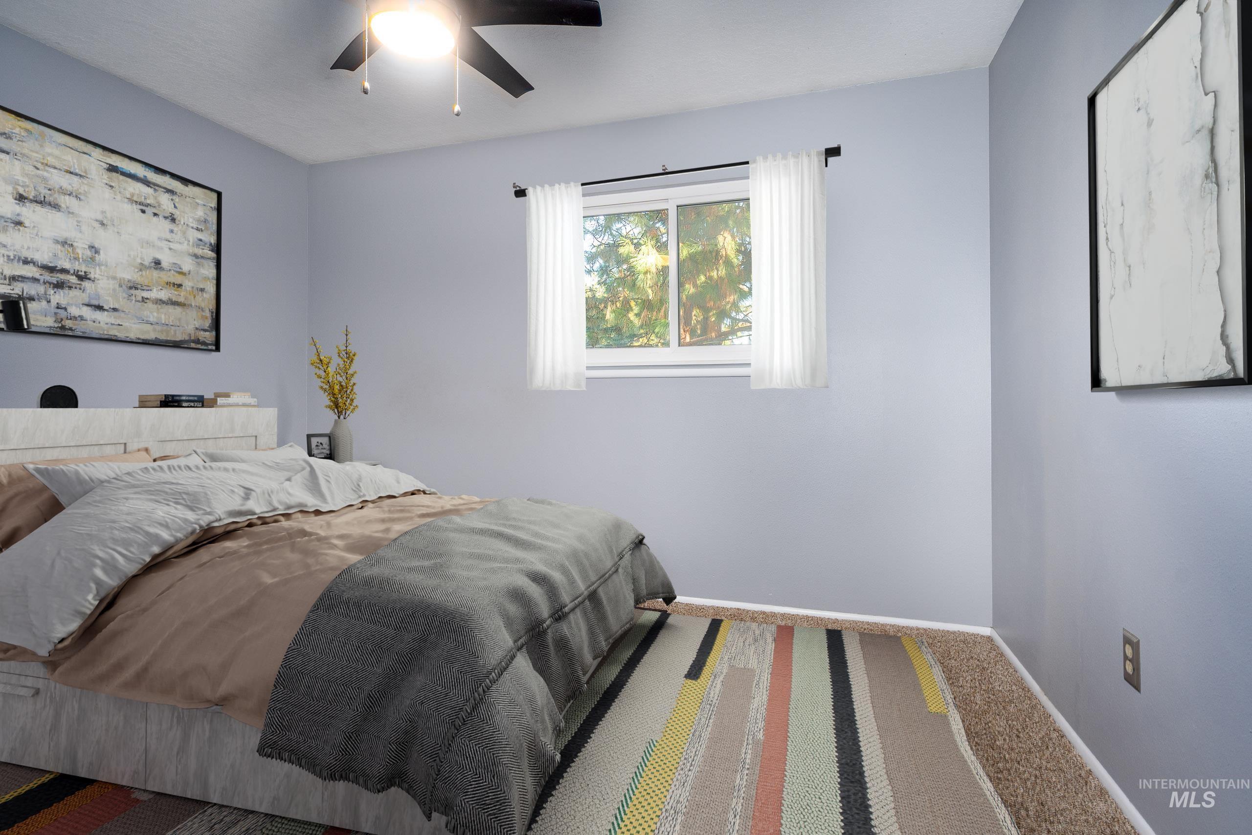 Bedroom with carpet flooring and ceiling fan