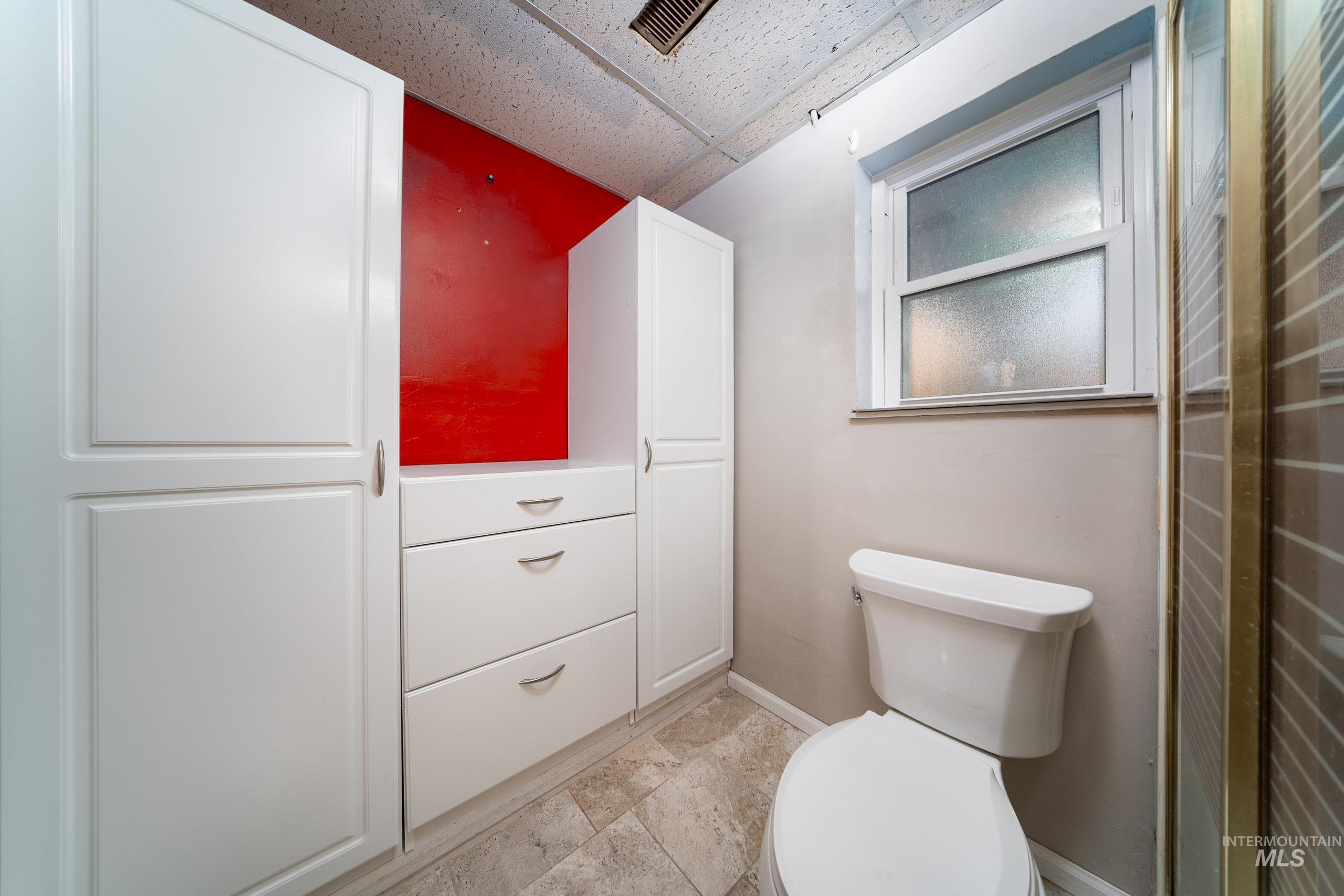 Bathroom with baseboards and toilet