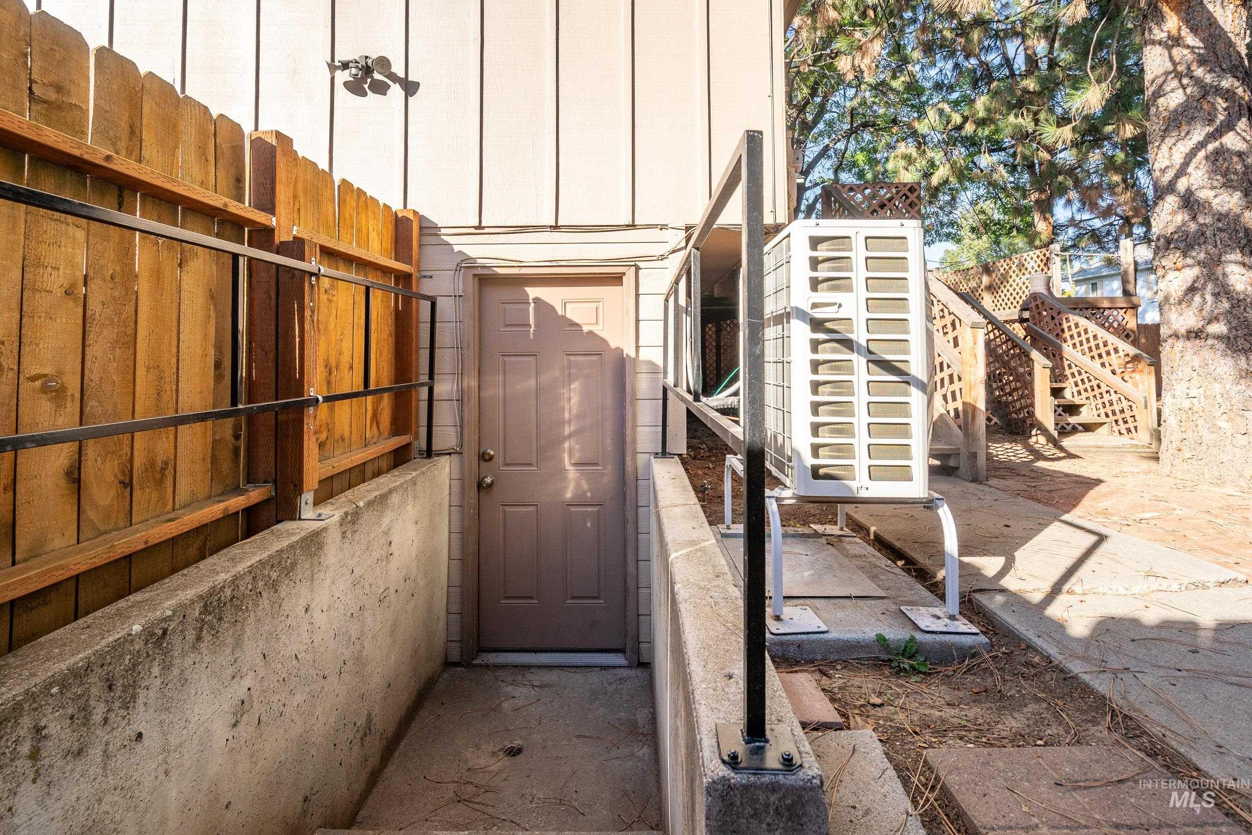 Doorway to property with a patio area