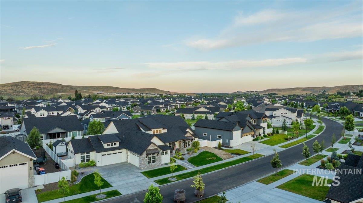 Aerial view at dusk of a residential view and a mountain view