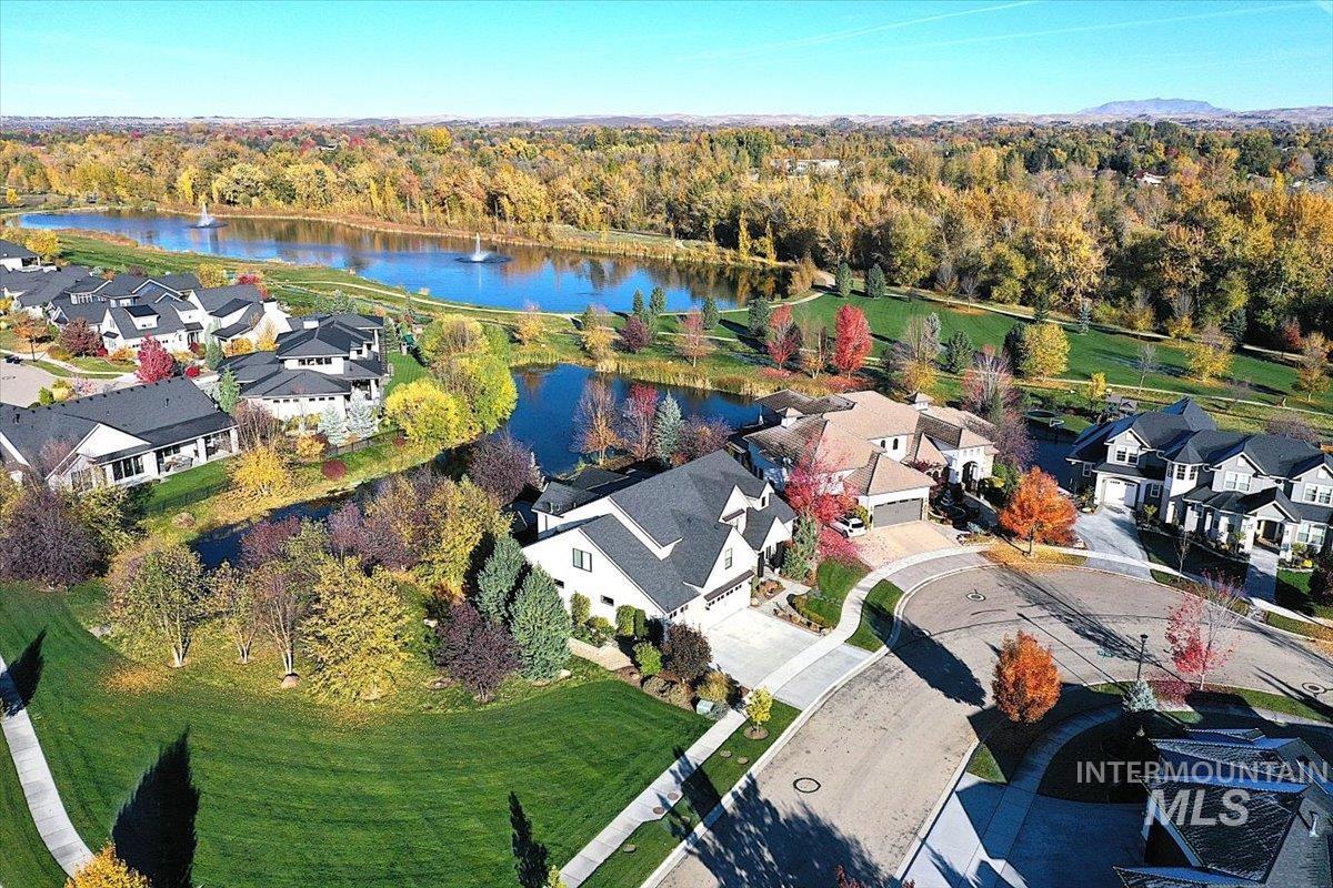 View of property location with a large body of water and nearby suburban area
