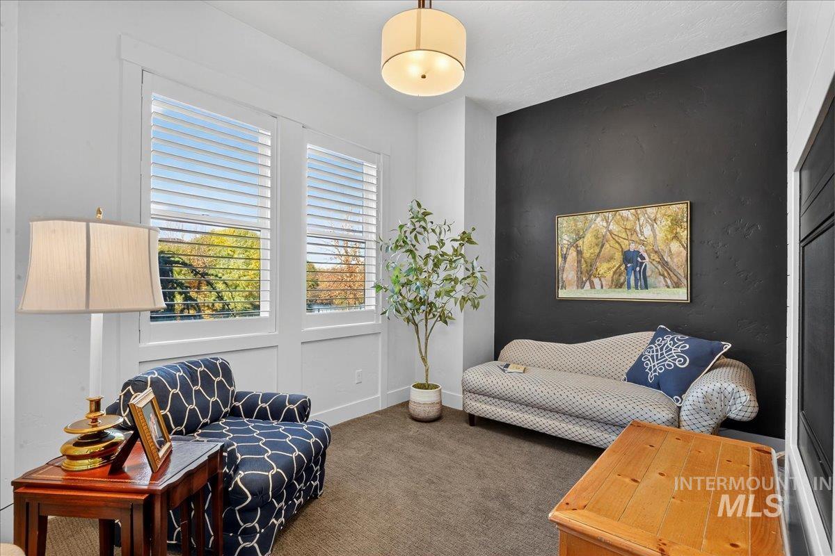 Sitting room with carpet flooring and baseboards