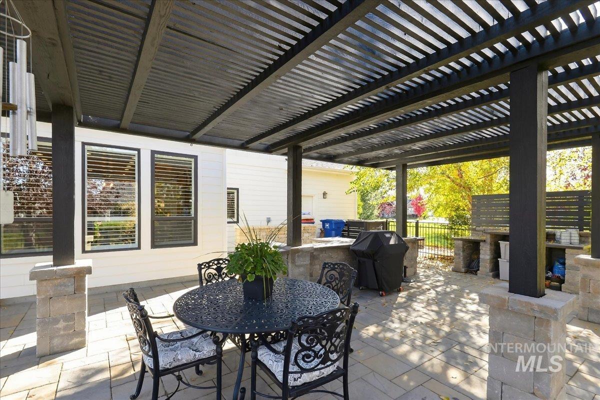 View of patio featuring outdoor dining area and grilling area