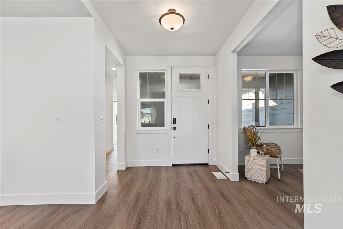 Foyer featuring wood finished floors and plenty of natural light