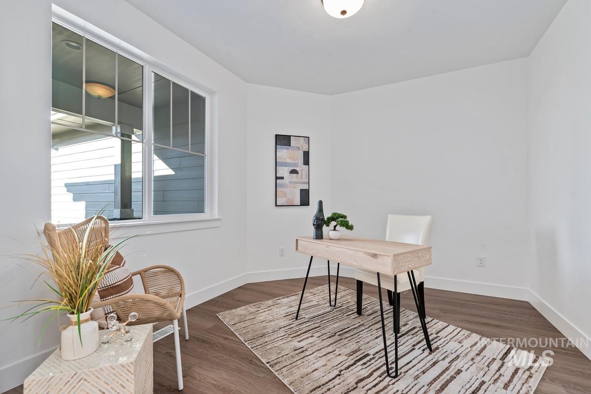 Office with dark wood finished floors