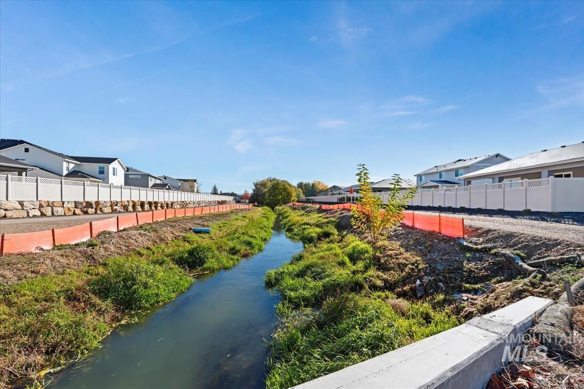View of community with a water view and a residential view