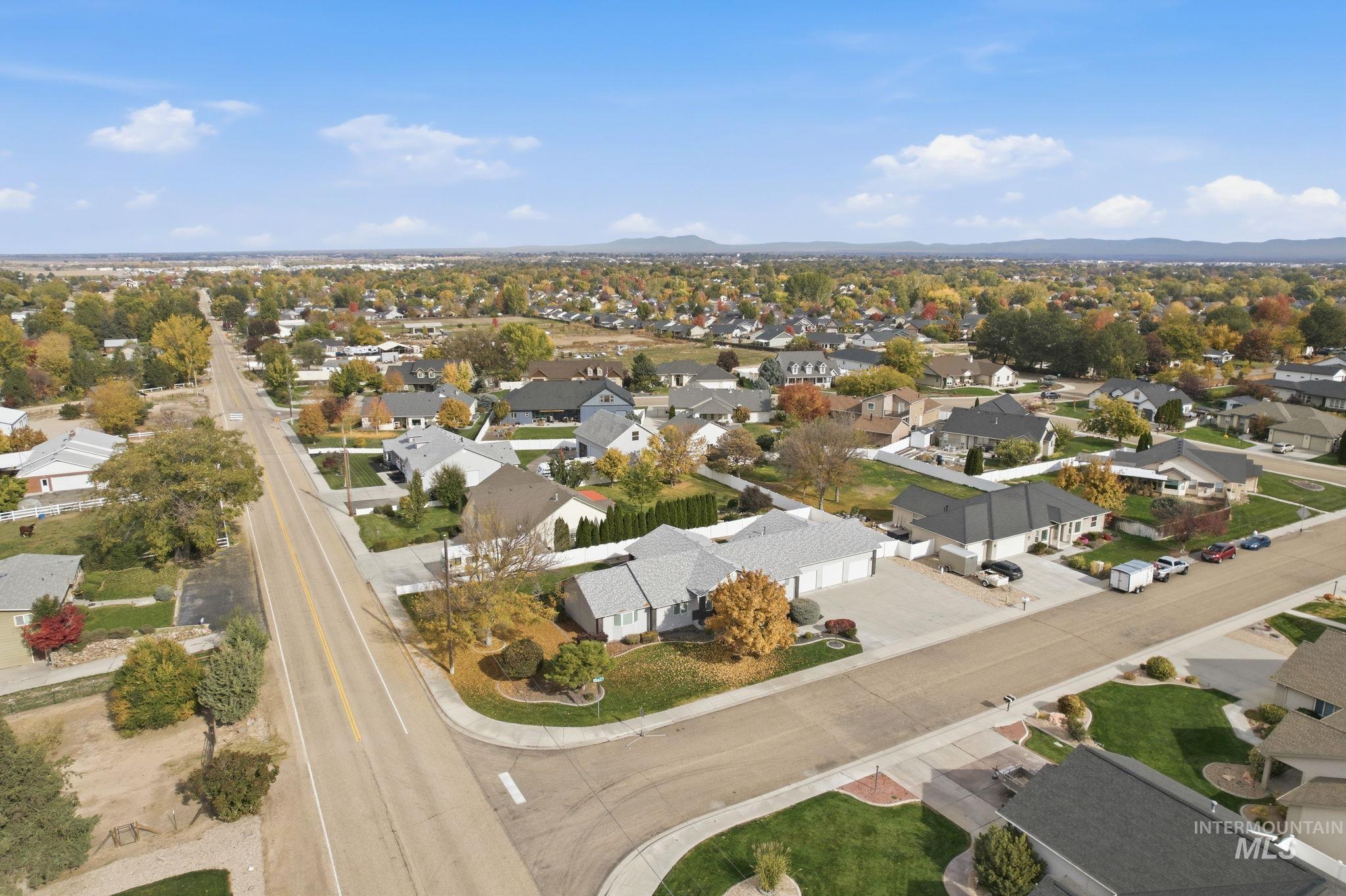 Aerial view of residential area with a mountainous background