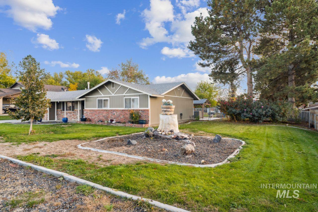 Craftsman-style home featuring a front lawn and brick siding