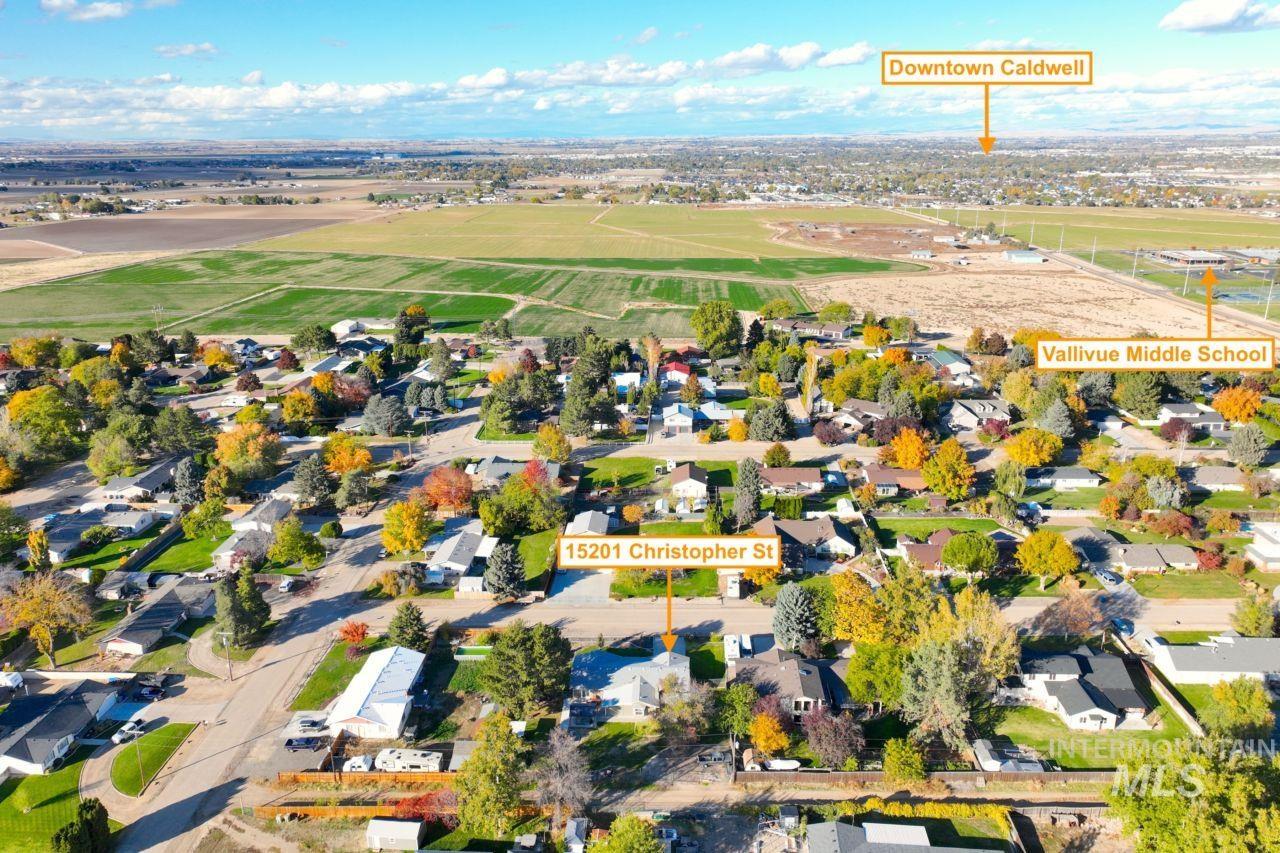 View of property location with nearby suburban area