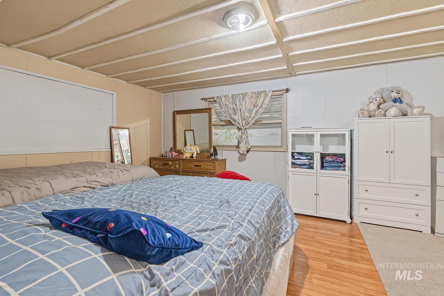 Bedroom featuring light wood-style flooring