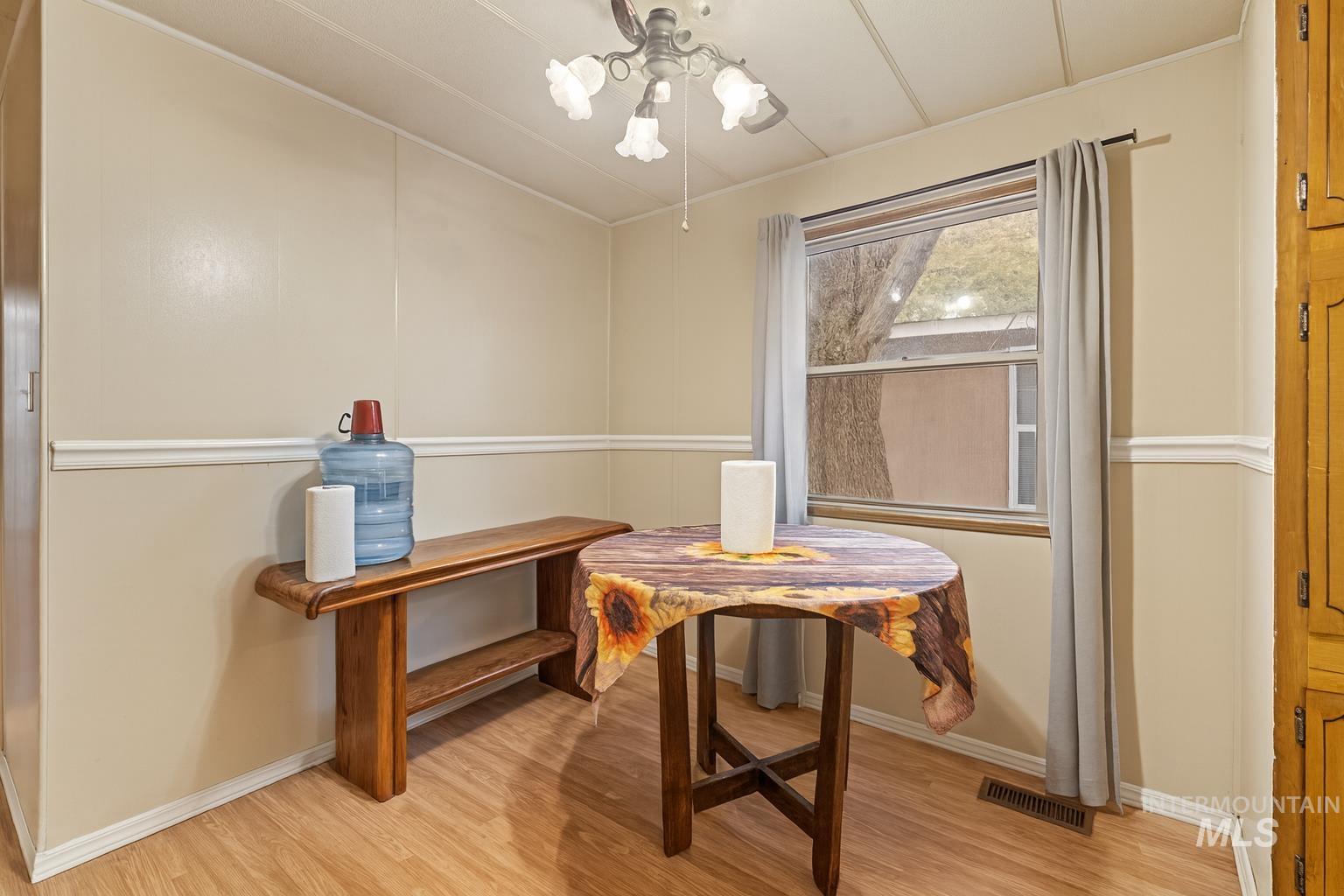 Dining space featuring light wood-type flooring and ceiling fan