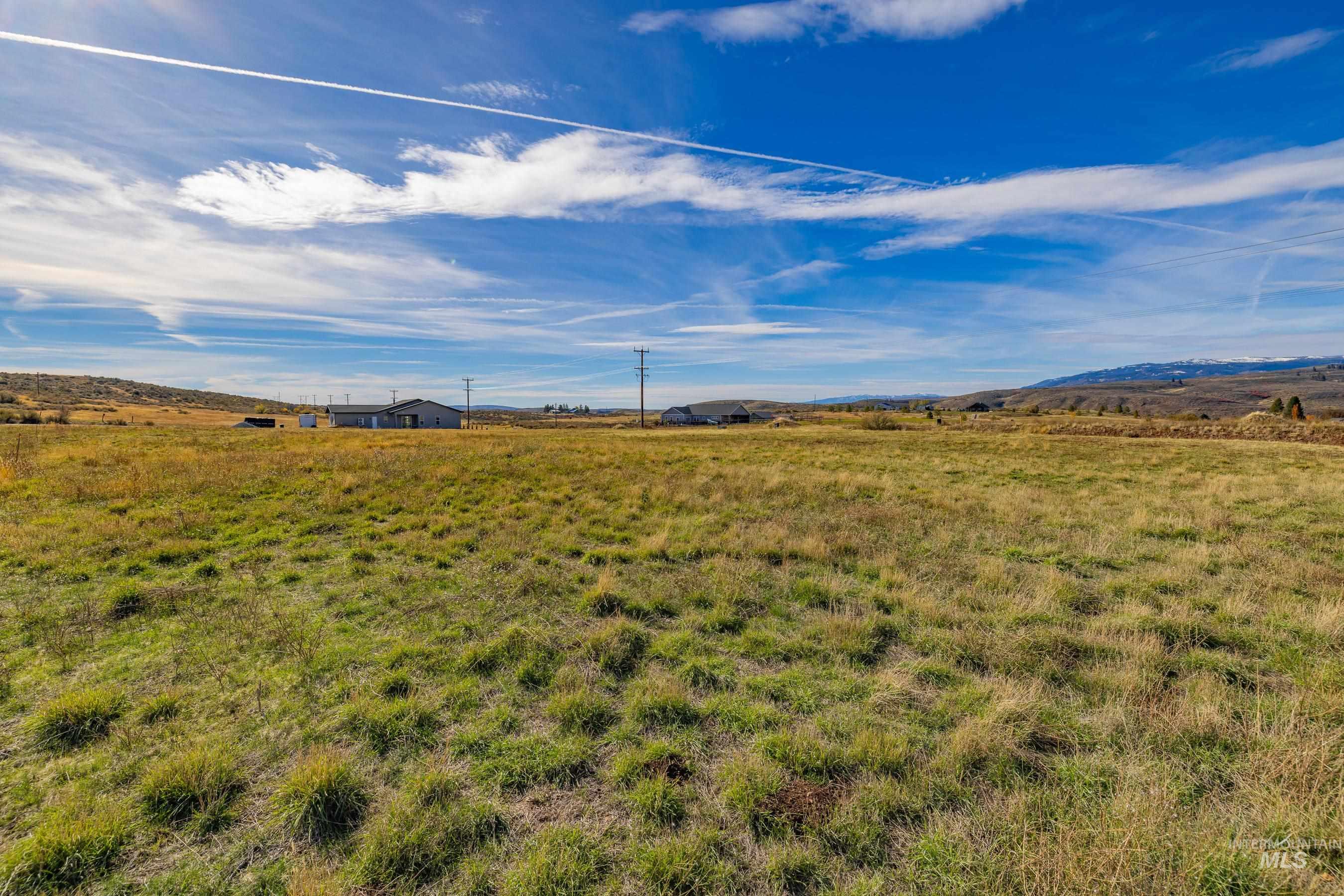 View of yard featuring a view of countryside and a mountain view