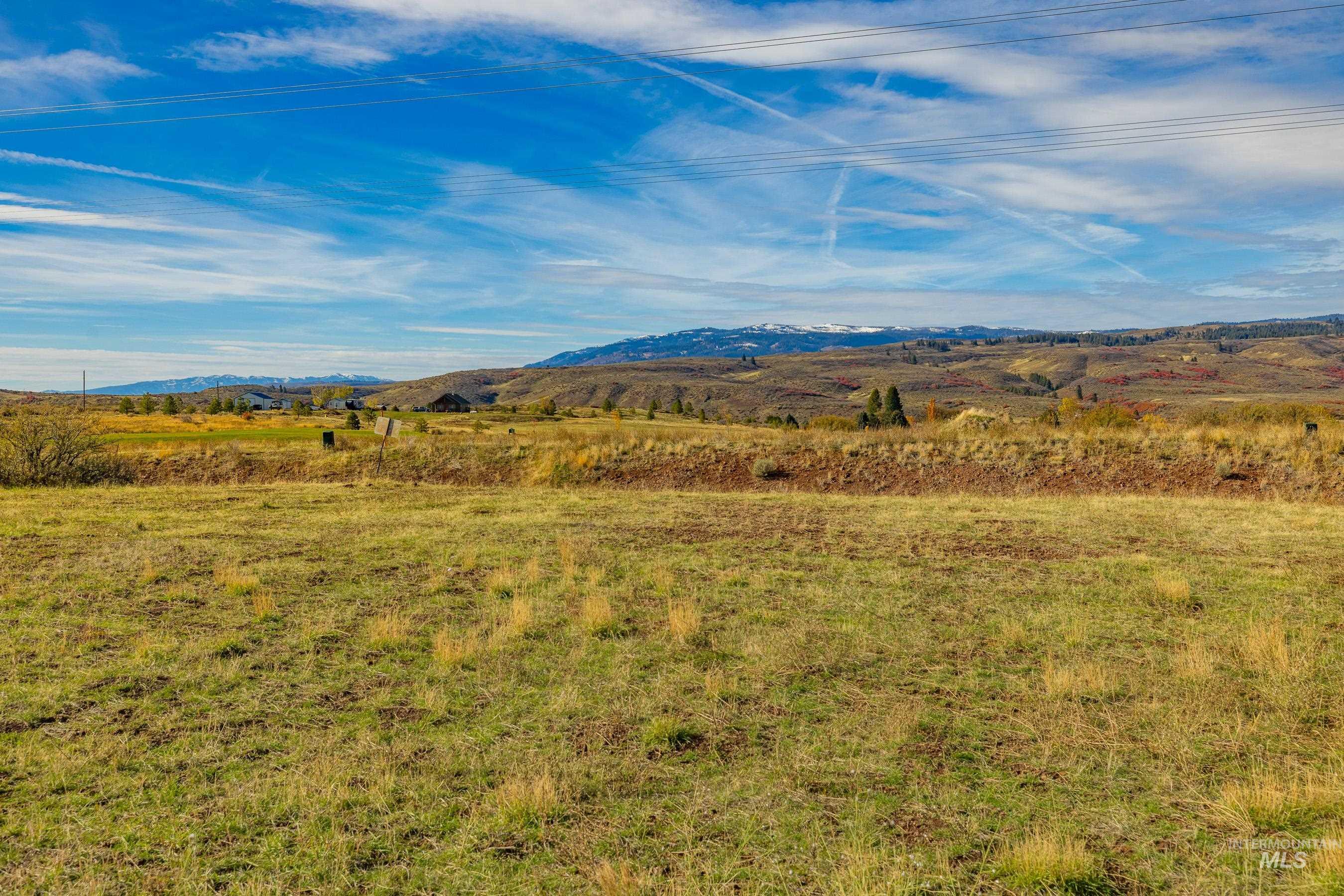 View of mountain backdrop featuring rural landscape