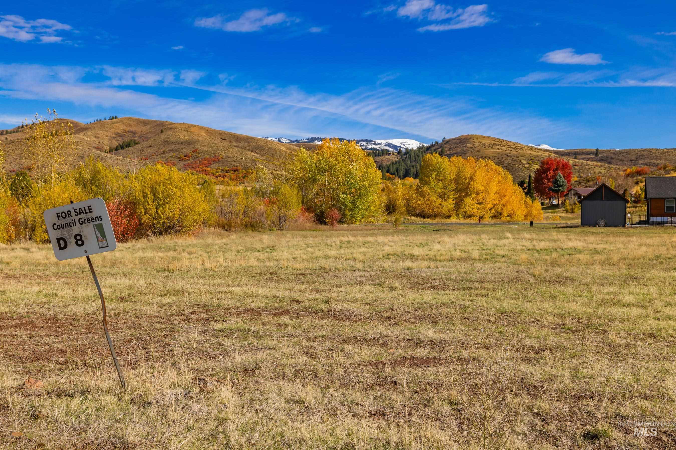 View of mountain backdrop with rural landscape