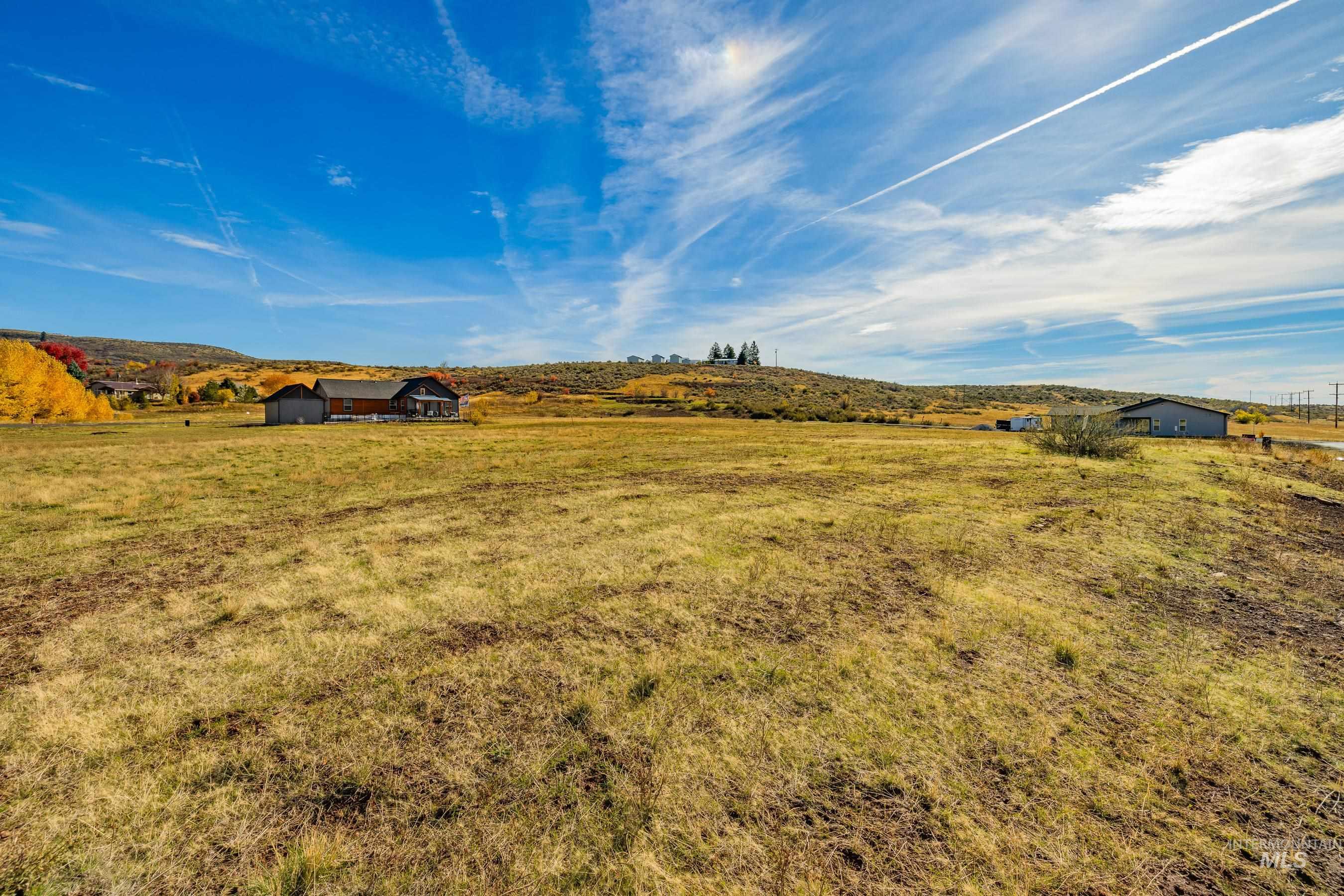 View of yard featuring a view of countryside and an outbuilding
