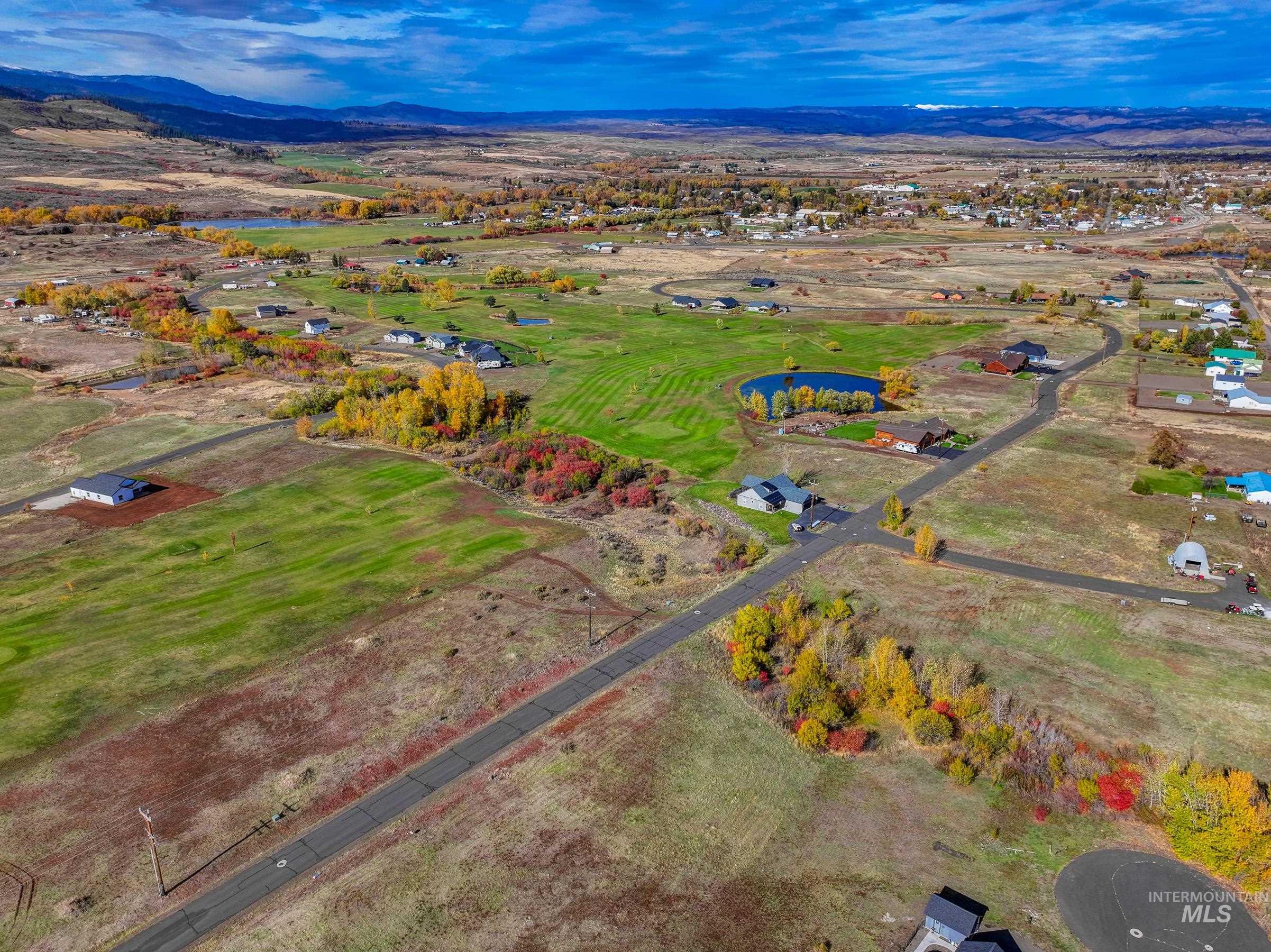 Aerial view of property's location with a water and mountain view