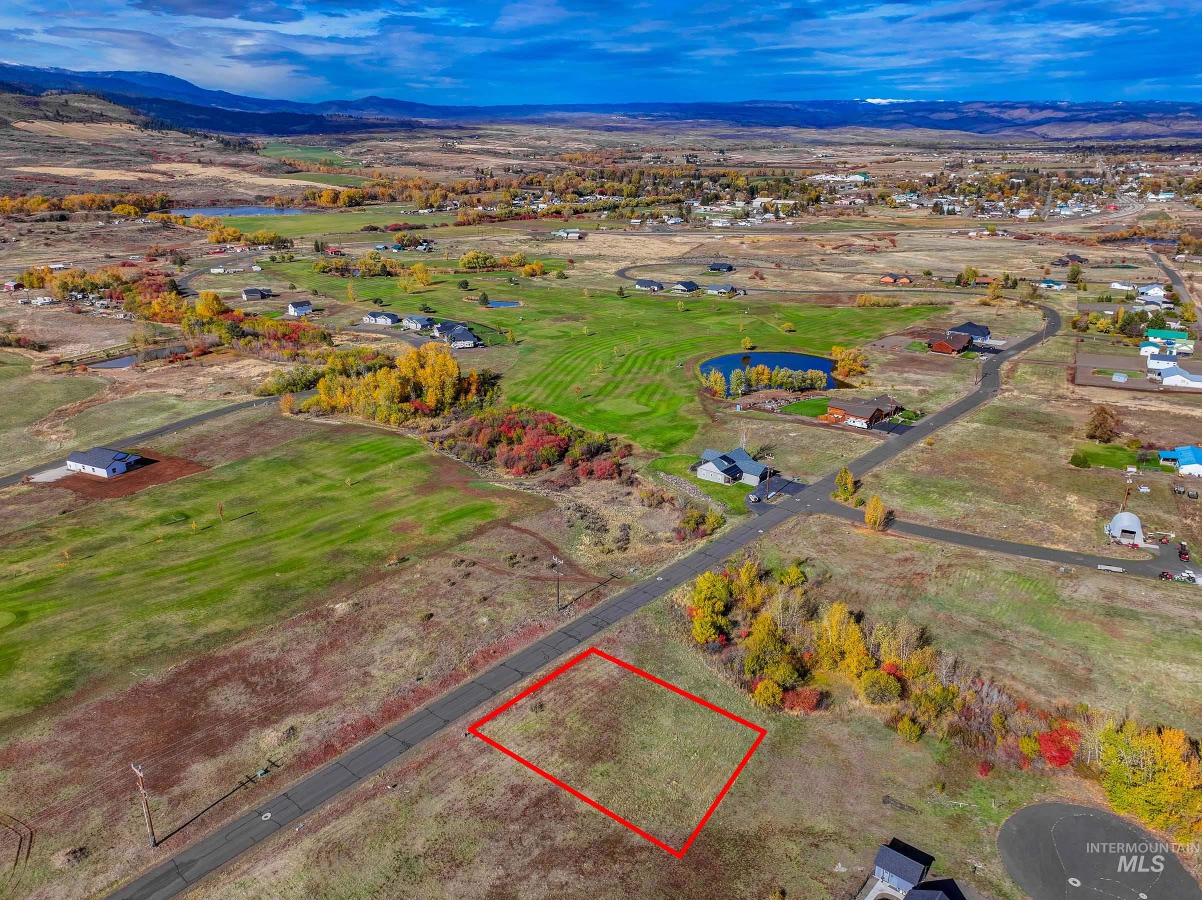 Aerial view of property's location featuring property boundaries highlighted and a water and mountain view