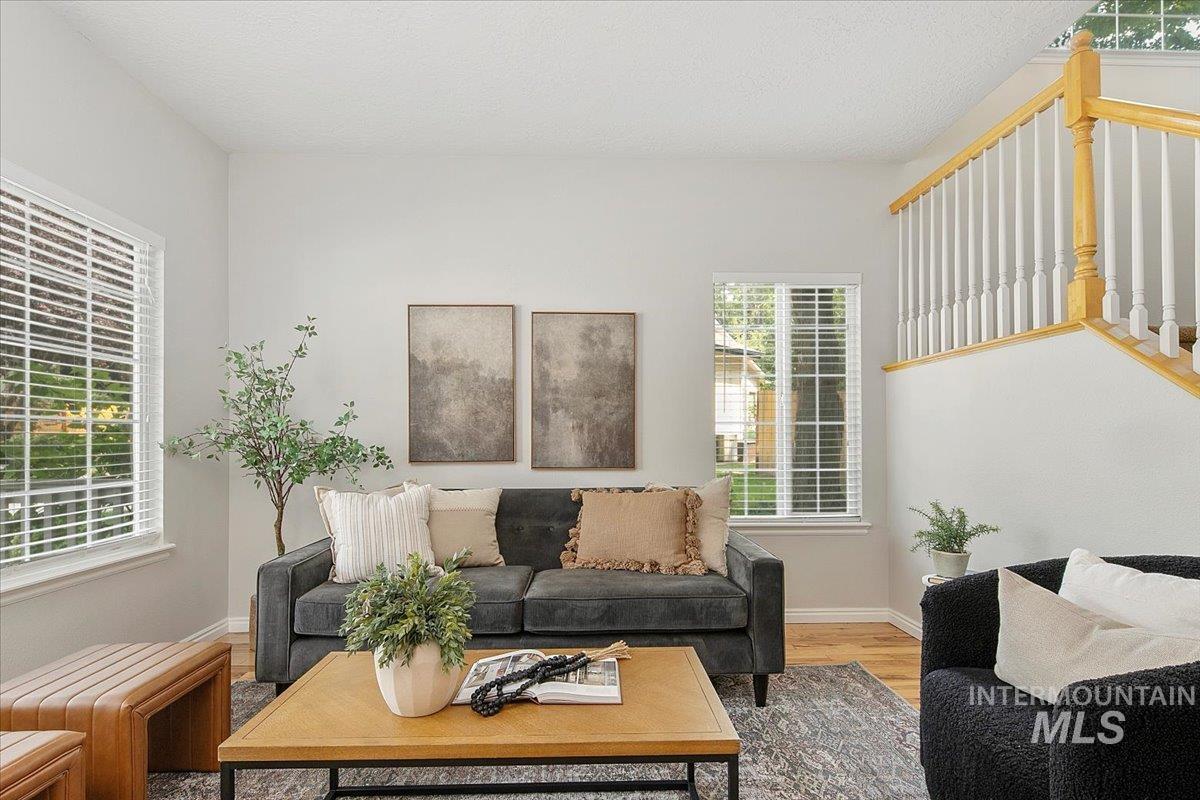 Living area with wood finished floors and a textured ceiling