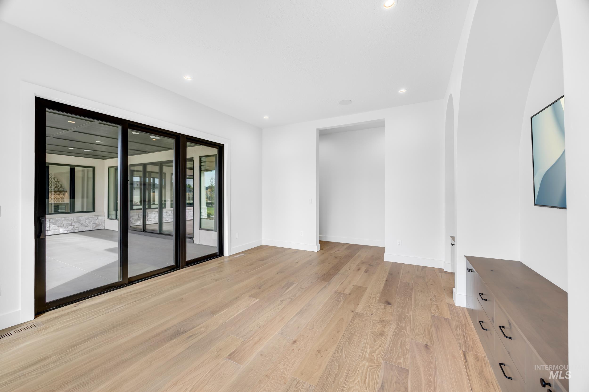Empty room with recessed lighting and light wood finished floors