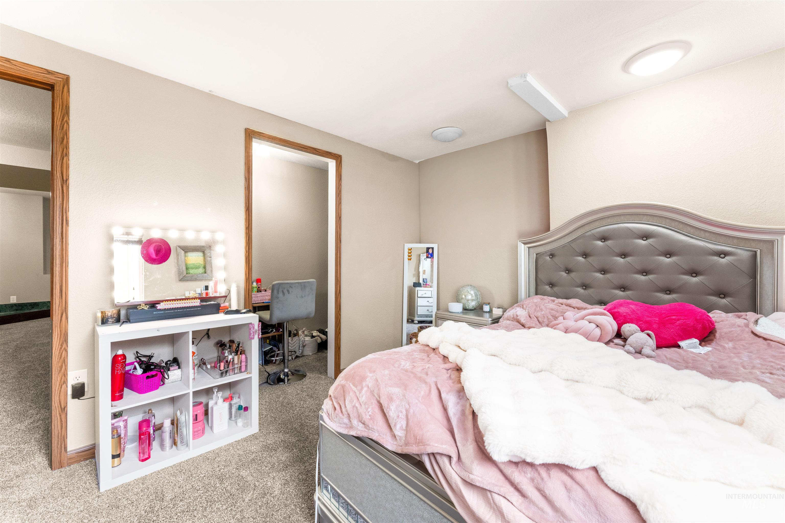 Bedroom with carpet floors and baseboards